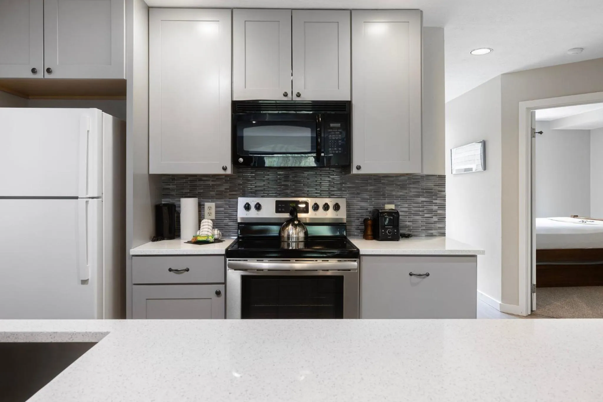 Communal kitchen in Evergreen Condominiums by Vail Resorts