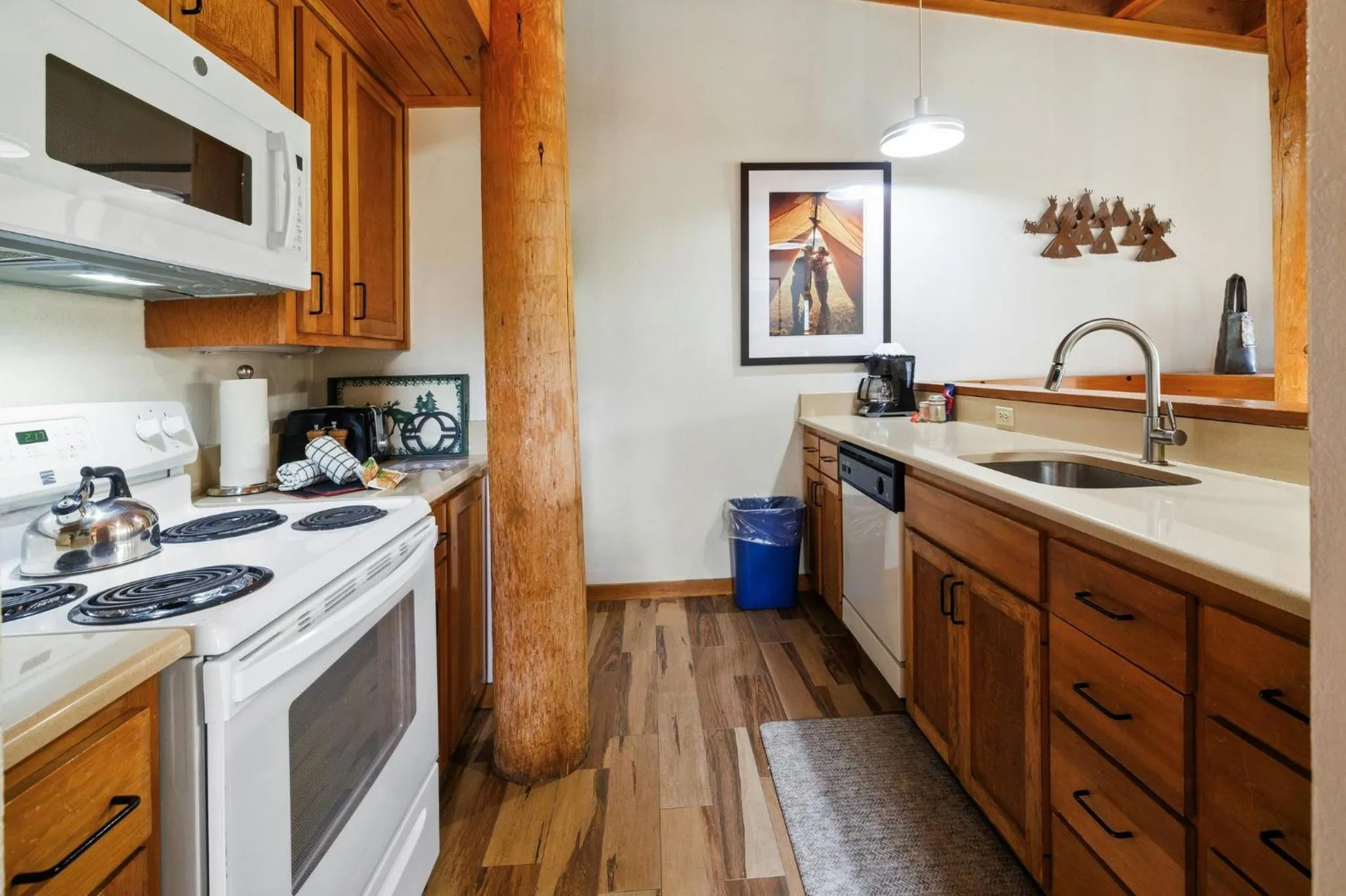 Communal kitchen in Evergreen Condominiums by Vail Resorts