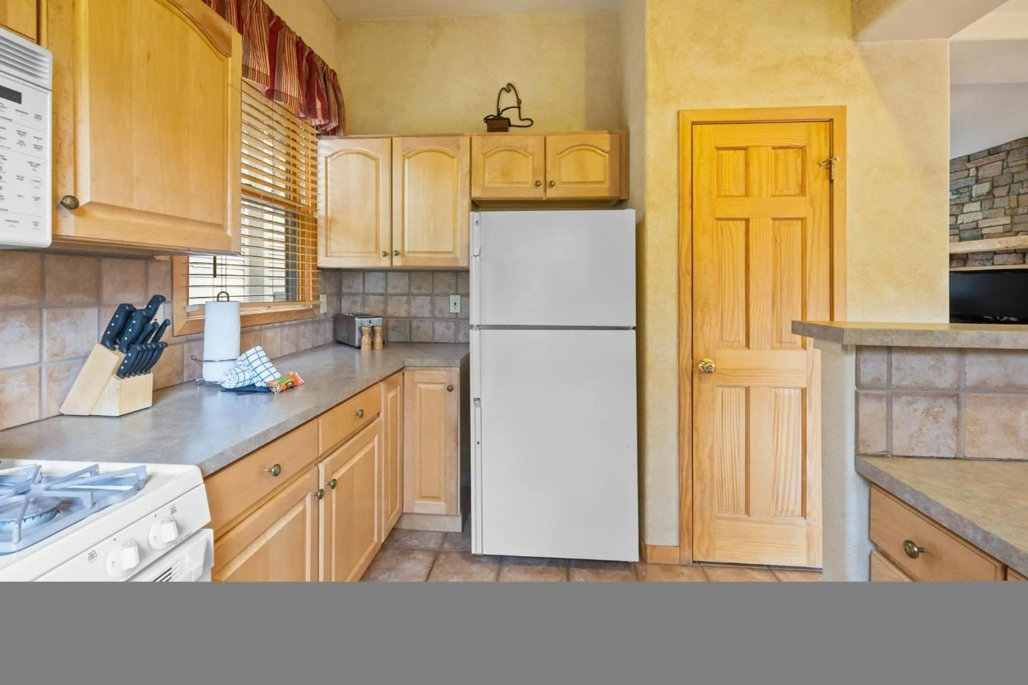 Communal kitchen in Forest Condominiums by Vail Resorts