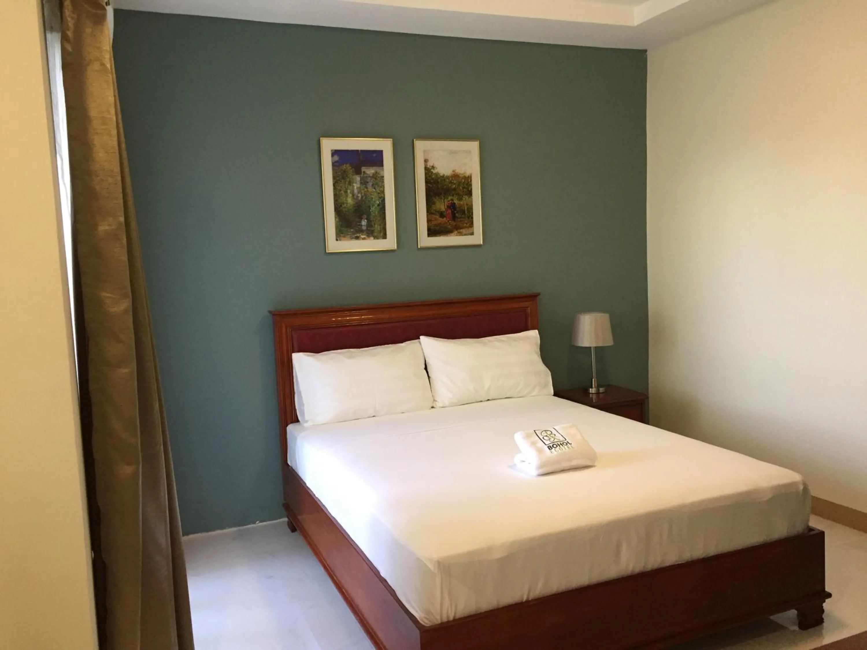 Photo of the whole room, Bed in Bohol Ecotel