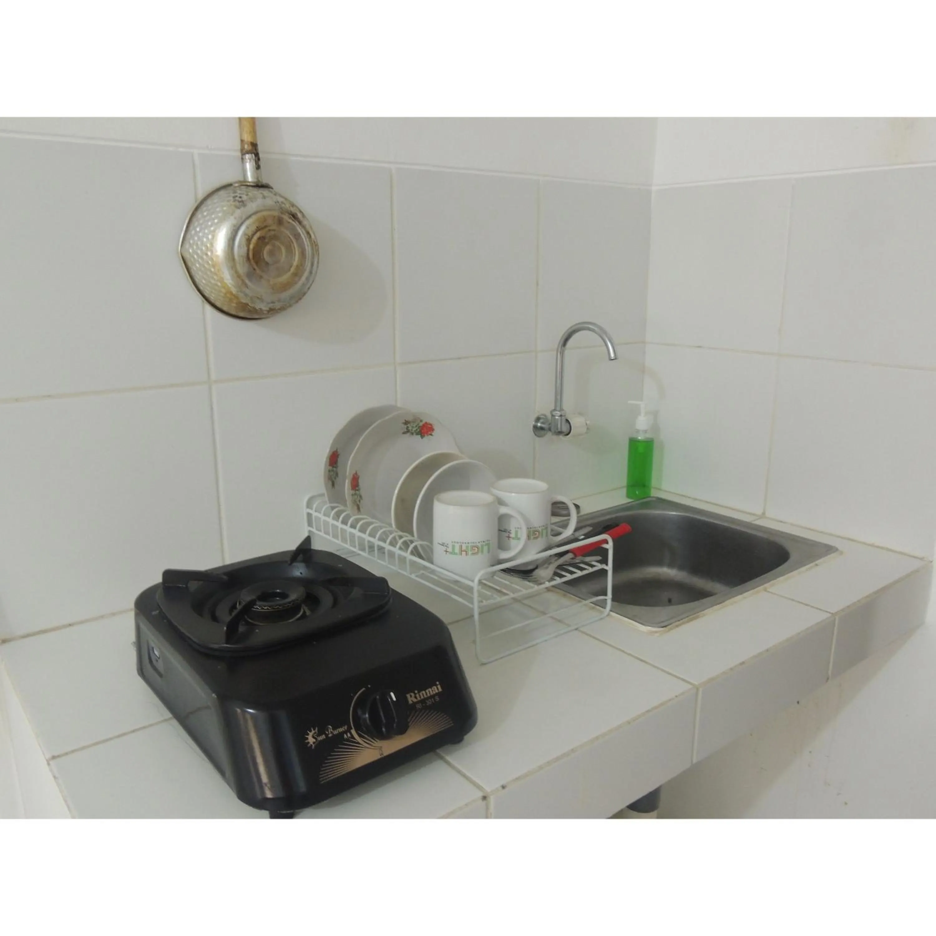 Kitchen or kitchenette in Reva Room on Gunung Putri Square Apartment