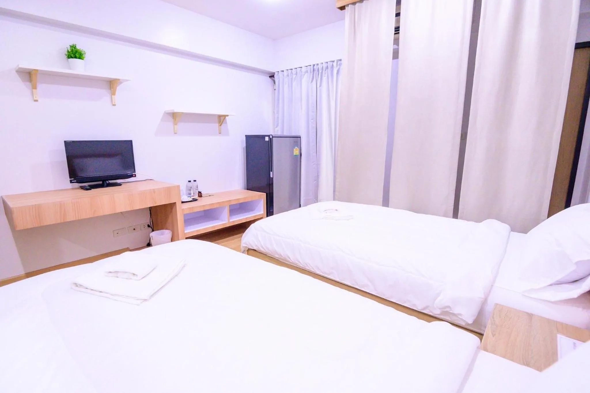 Bed in Creston Grand Hotel Suphan Buri