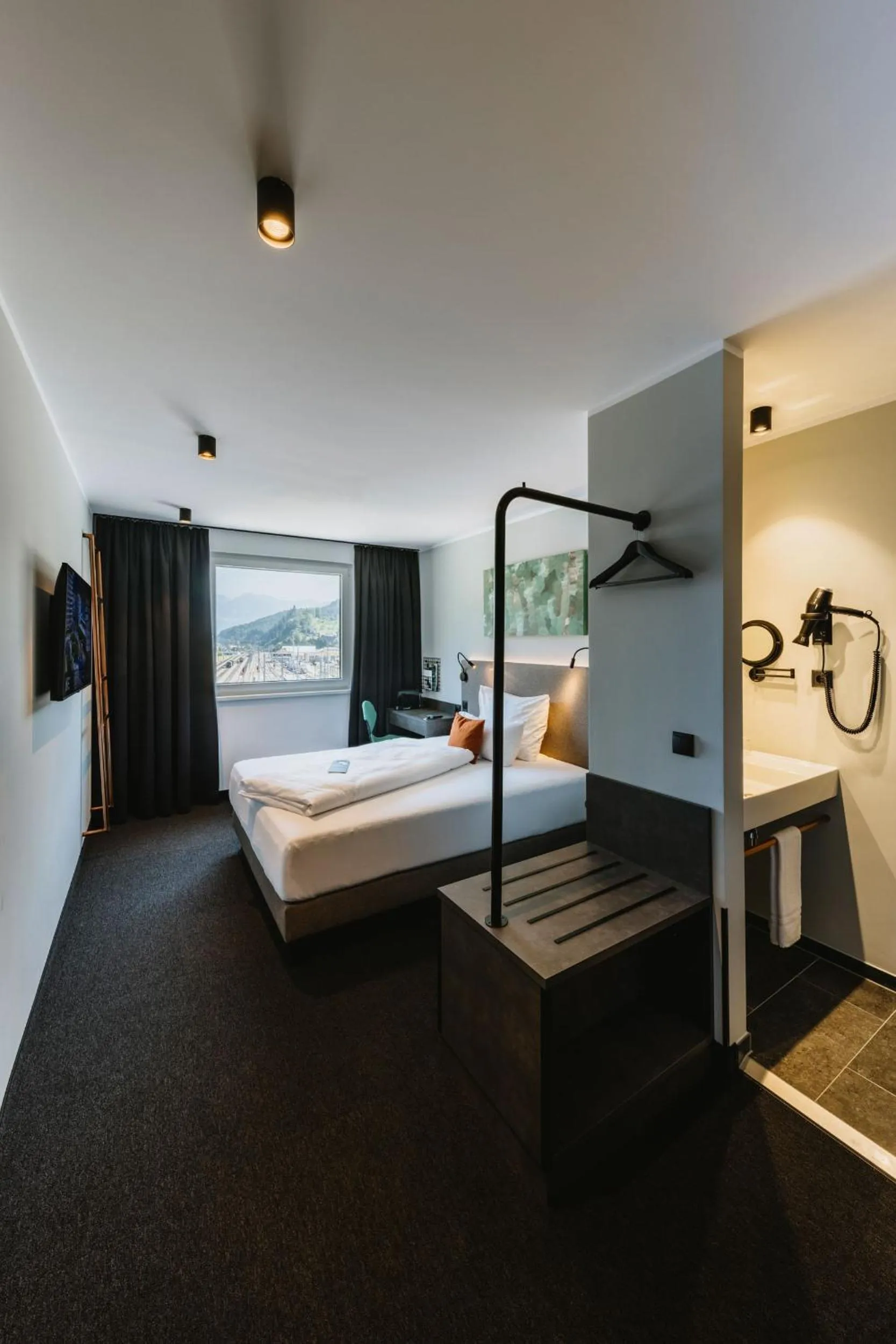 Photo of the whole room, Bed in NIGHT INN Hotel Bahnhofcity Feldkirch