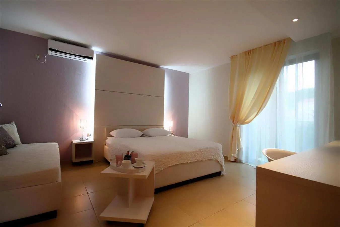 Bed in Domador Rooms & Apartments