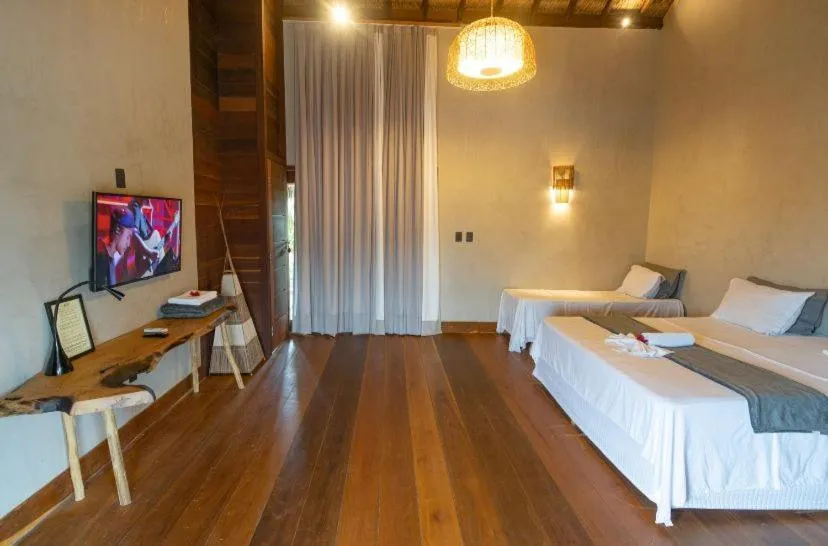 Bed in Pousada Rota dos Ventos