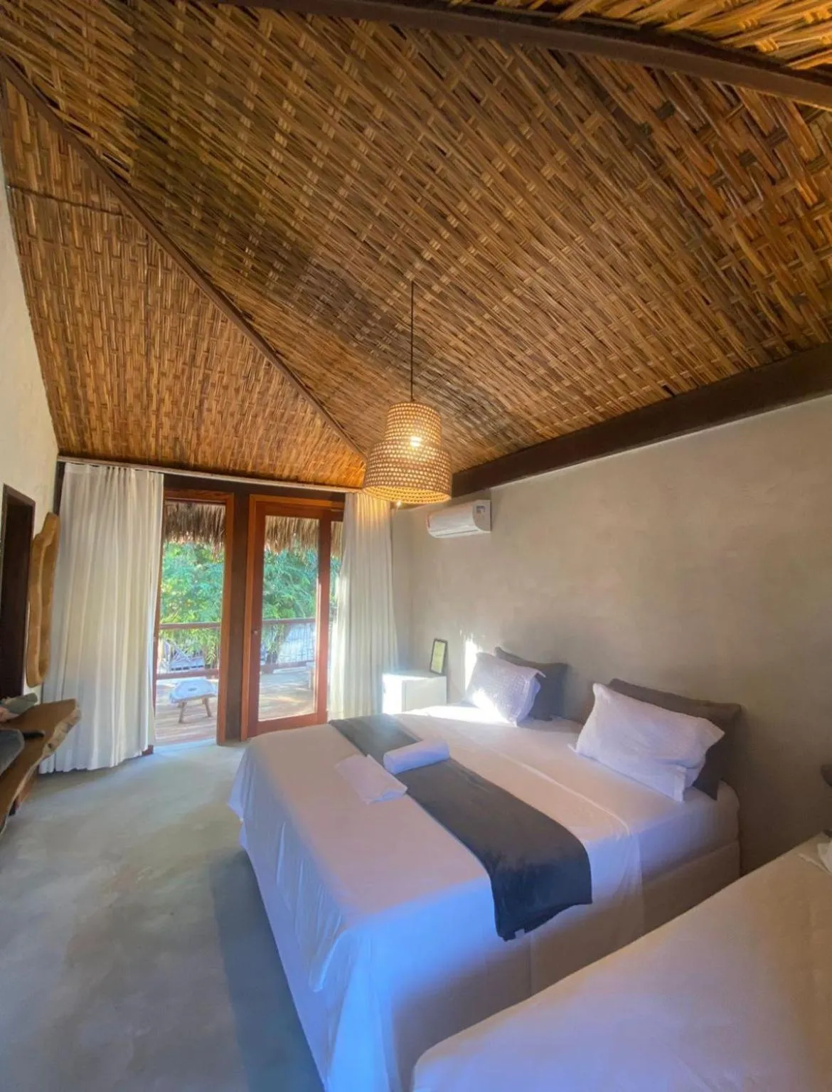 Bed in Pousada Rota dos Ventos