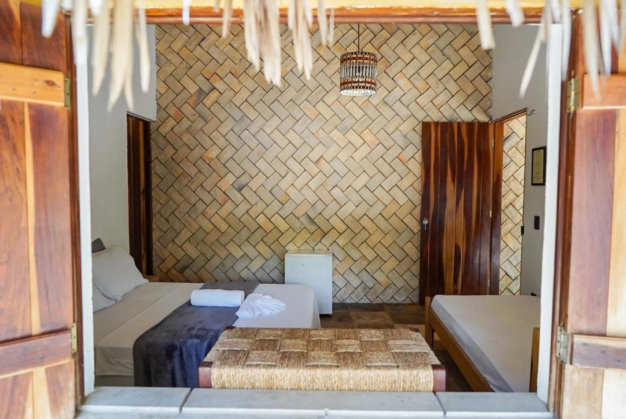 Bed in Pousada Rota dos Ventos