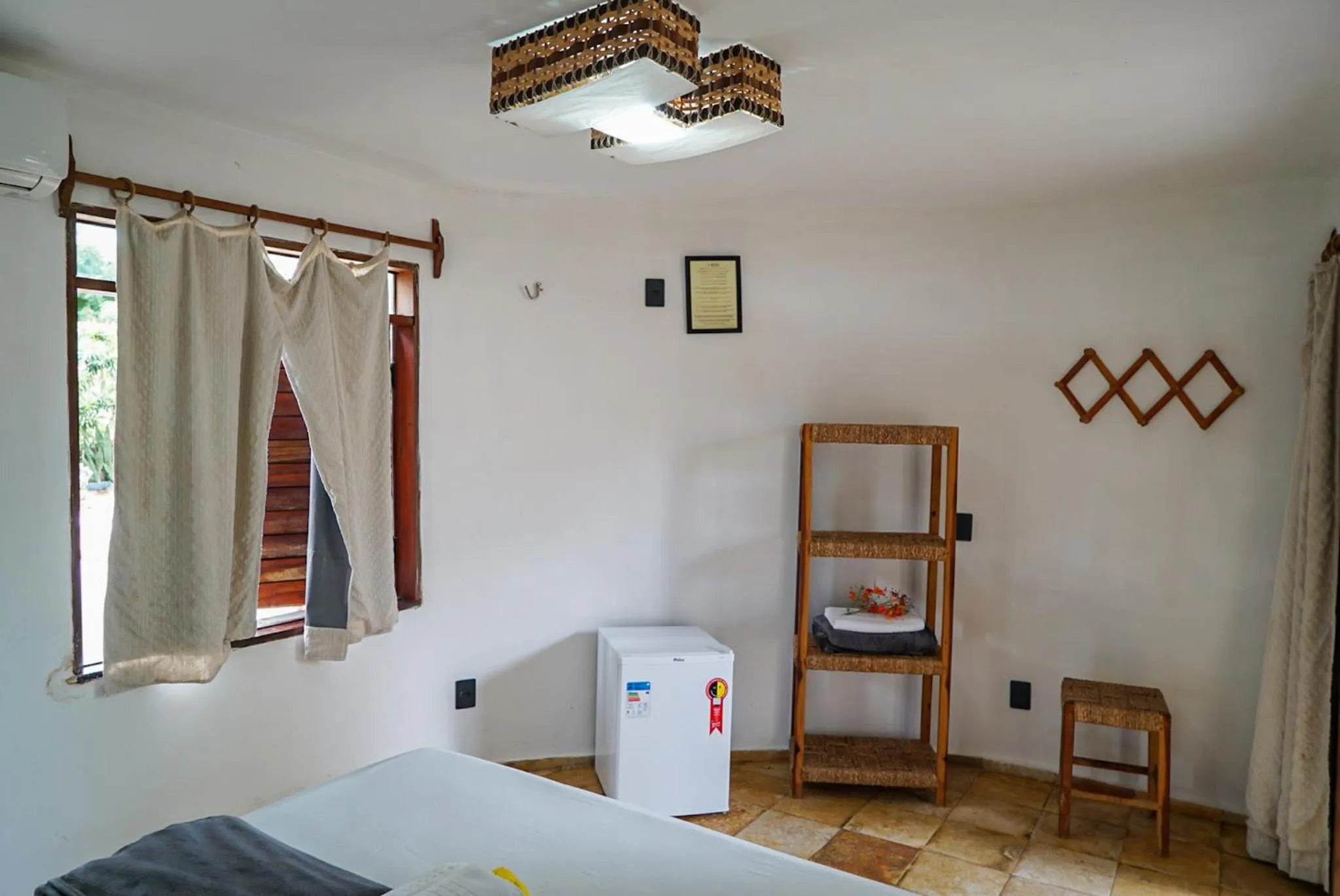 Bed in Pousada Rota dos Ventos