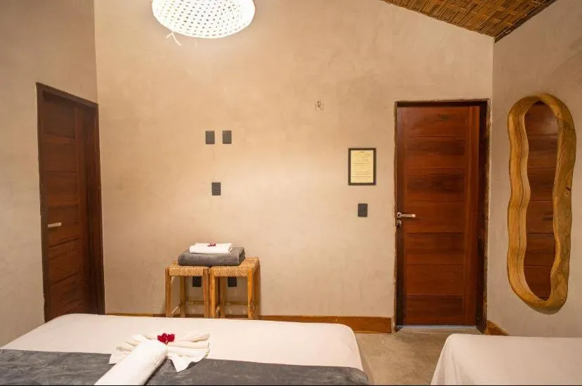 Bed in Pousada Rota dos Ventos