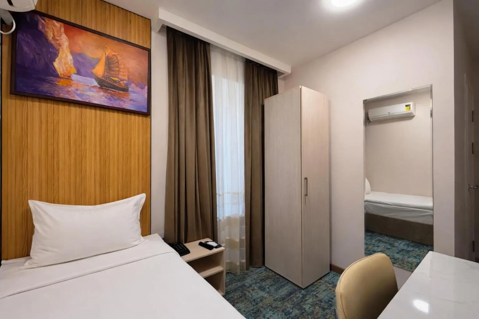 Bed in Musafir Hotel