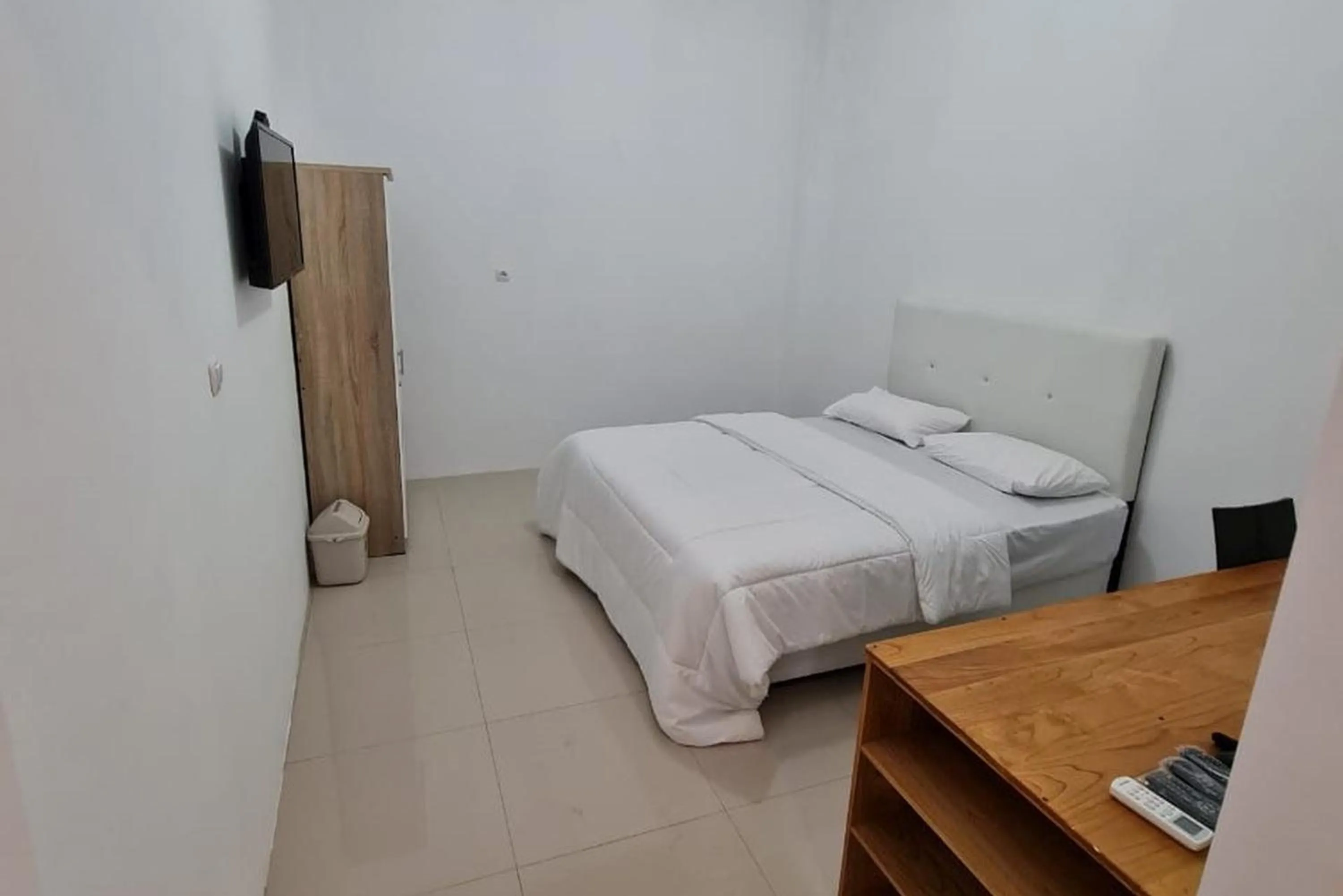 Bed in Krisan Guest House Syariah Banjarbaru Mitra RedDoorz