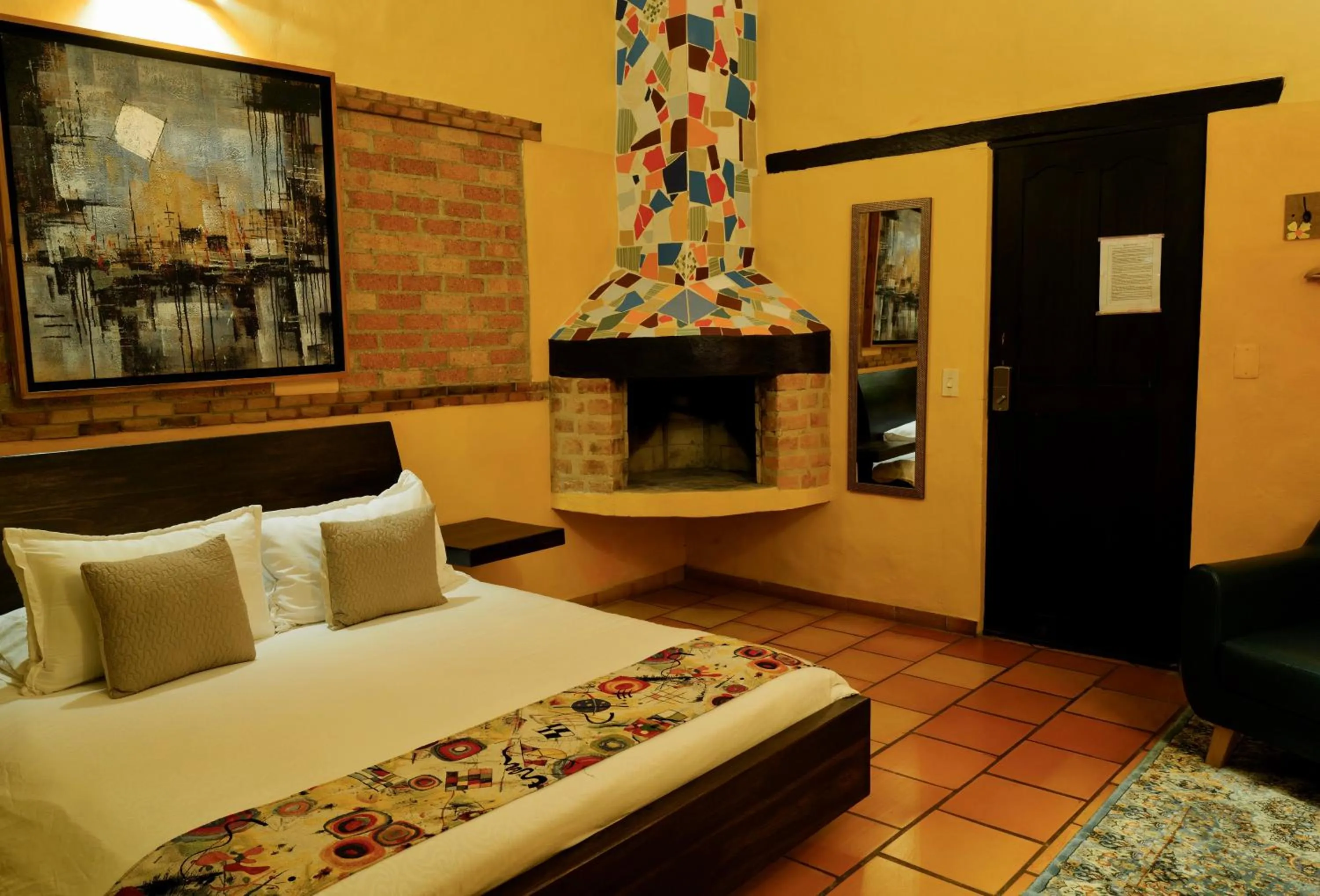 fireplace, Bed in Elephantia Spa Hotel