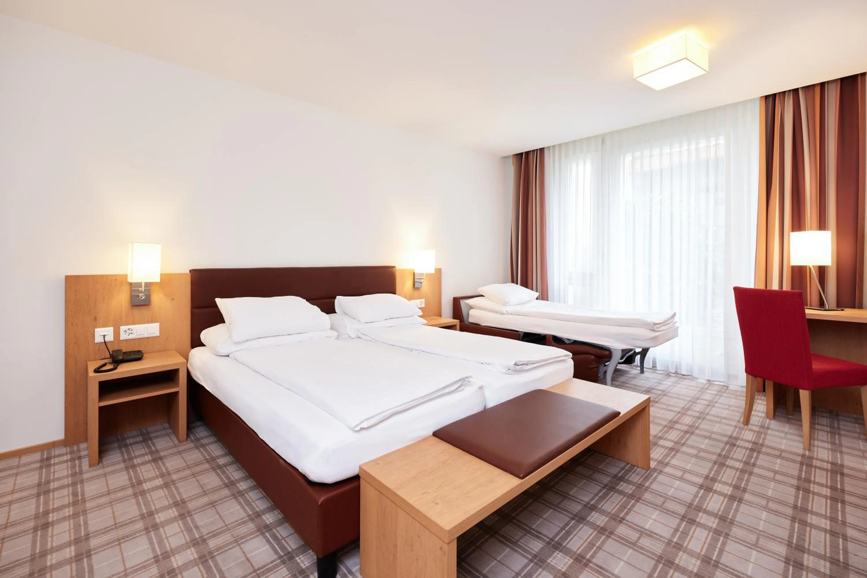 Bed in Central City Hotel Rochat