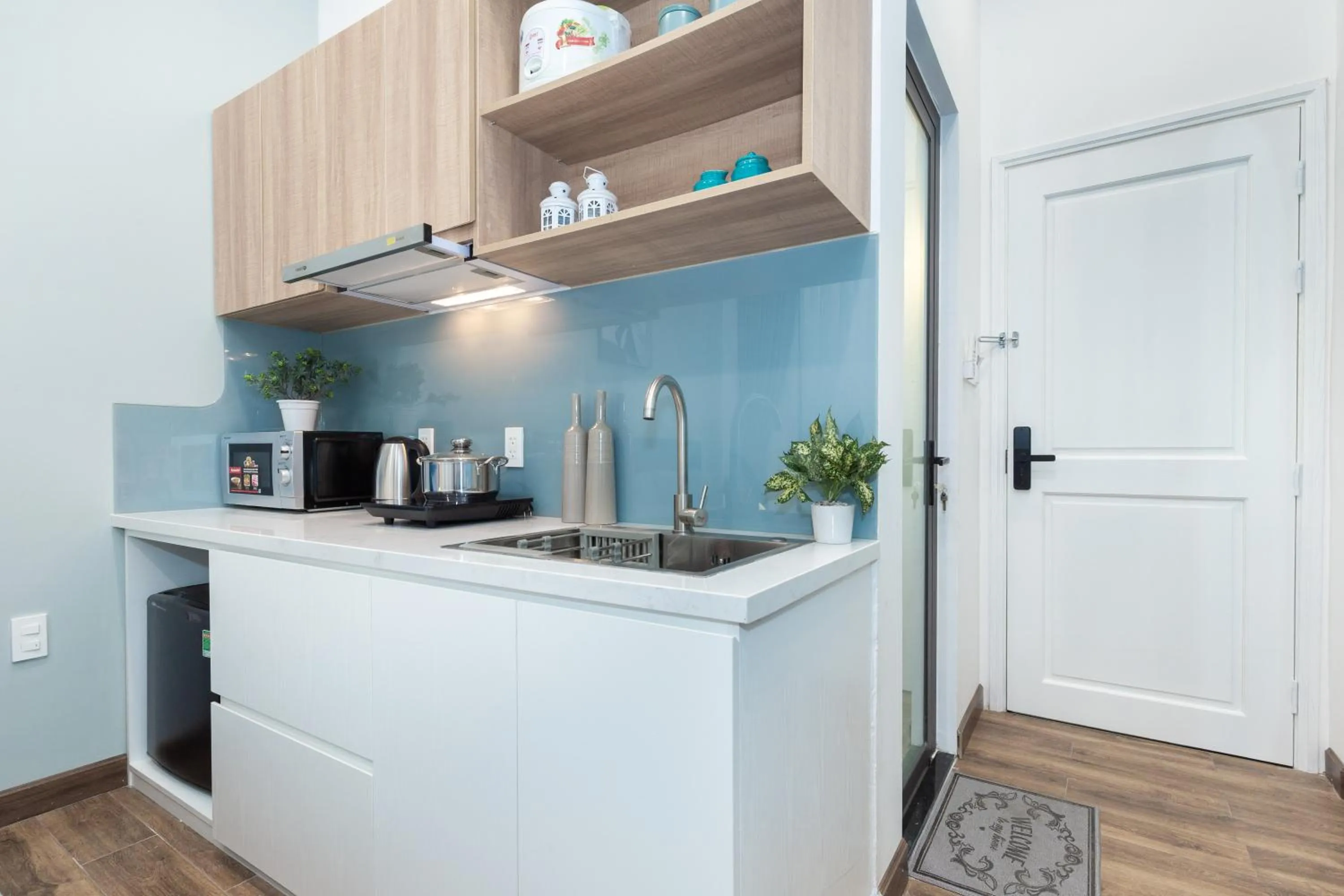Kitchen or kitchenette in Cozrum Homes Greena House