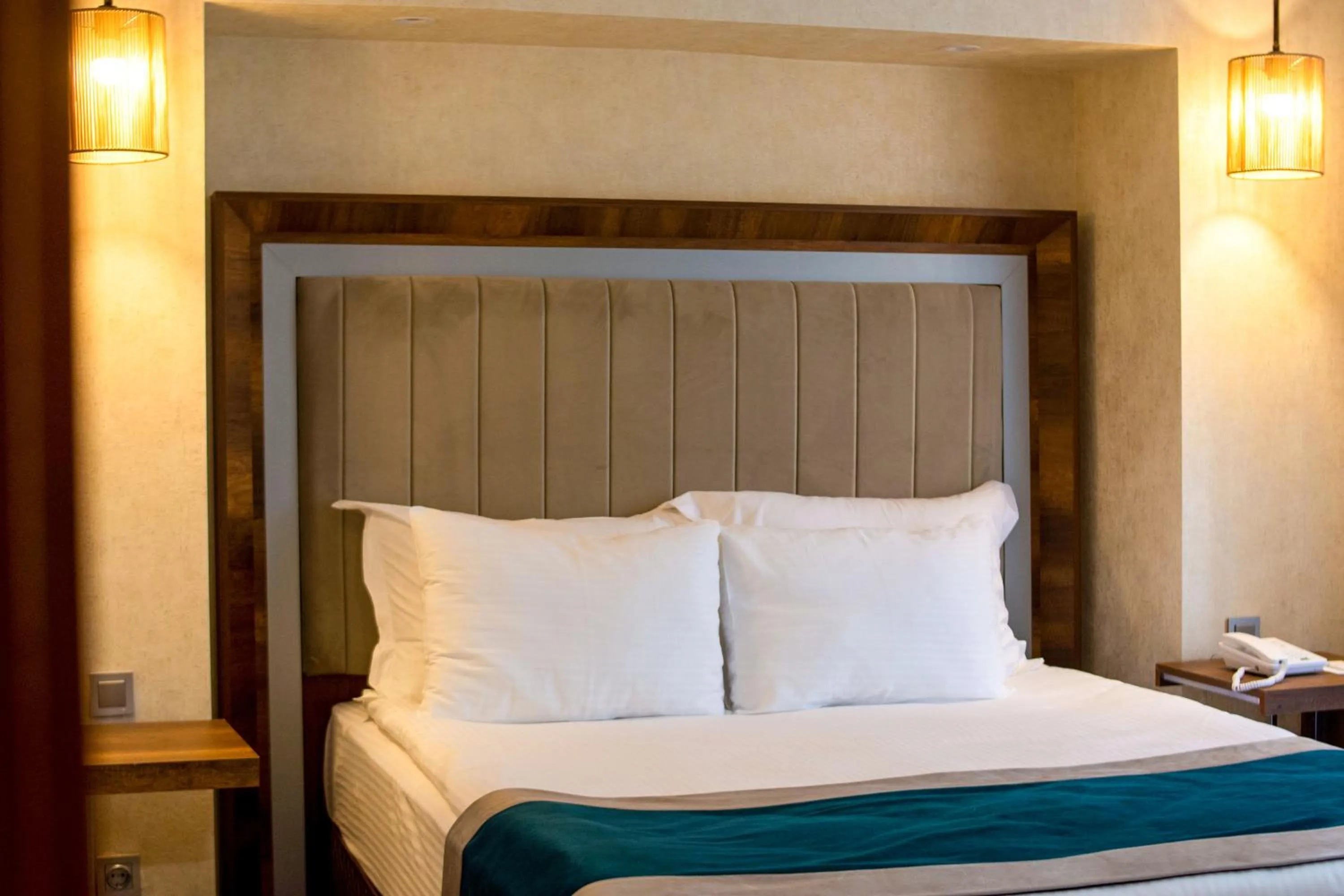 Bed in The Life Hotel & Spa