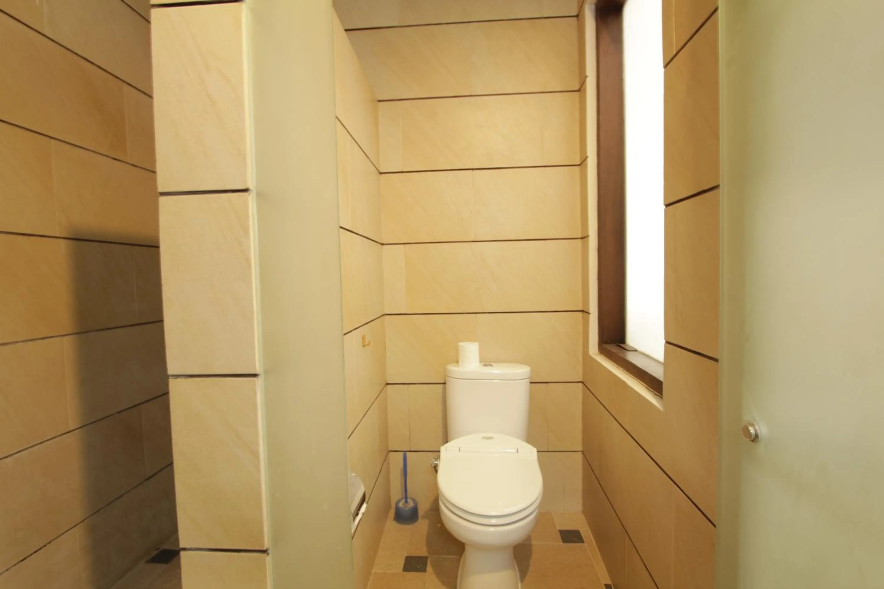 Bathroom in Alit Beach Resort and Villas