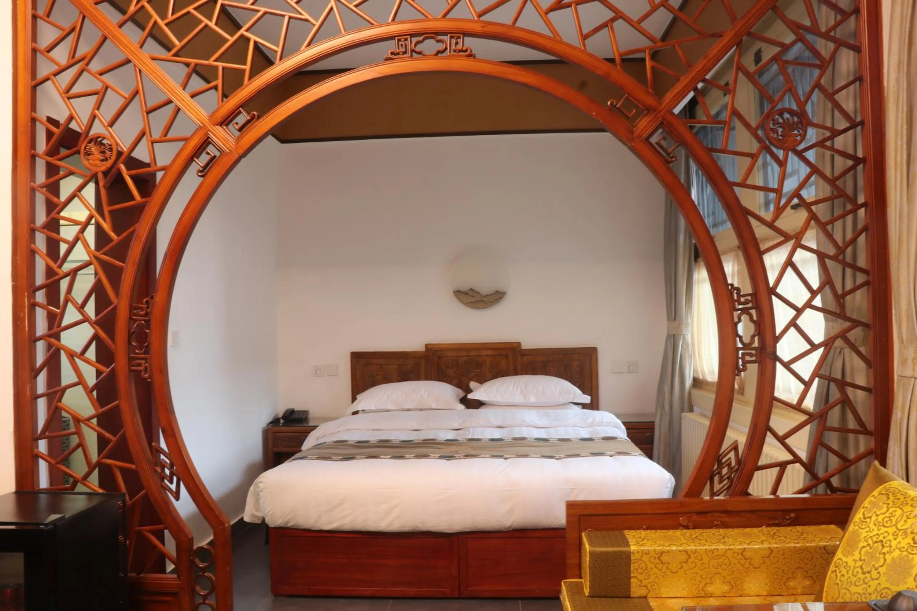 Bed in Beijing Jingyuan Courtyard Hotel