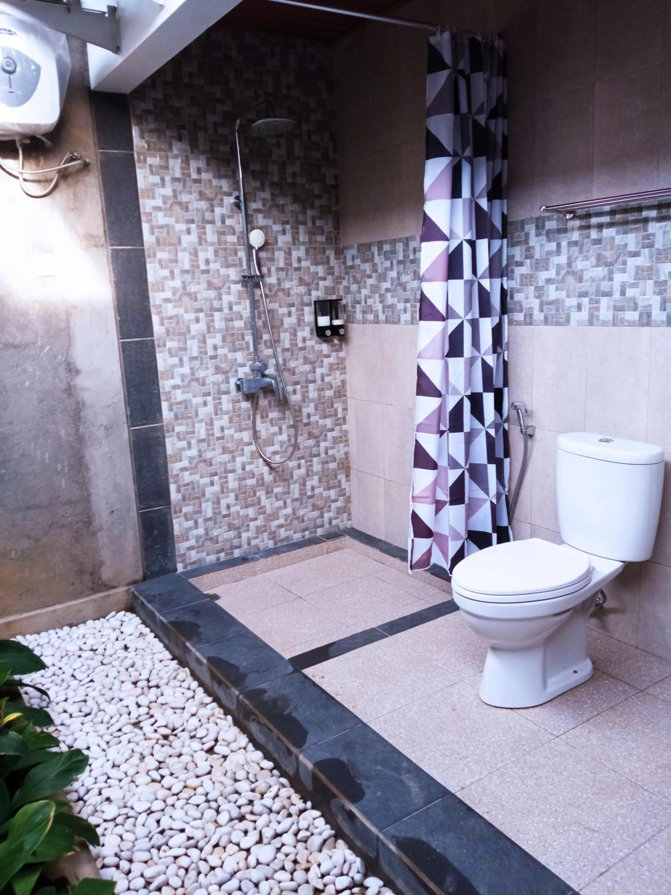 Bathroom in Tamiu Guesthouse at Desa Wisata Keramas Near Keramas Surf Beach