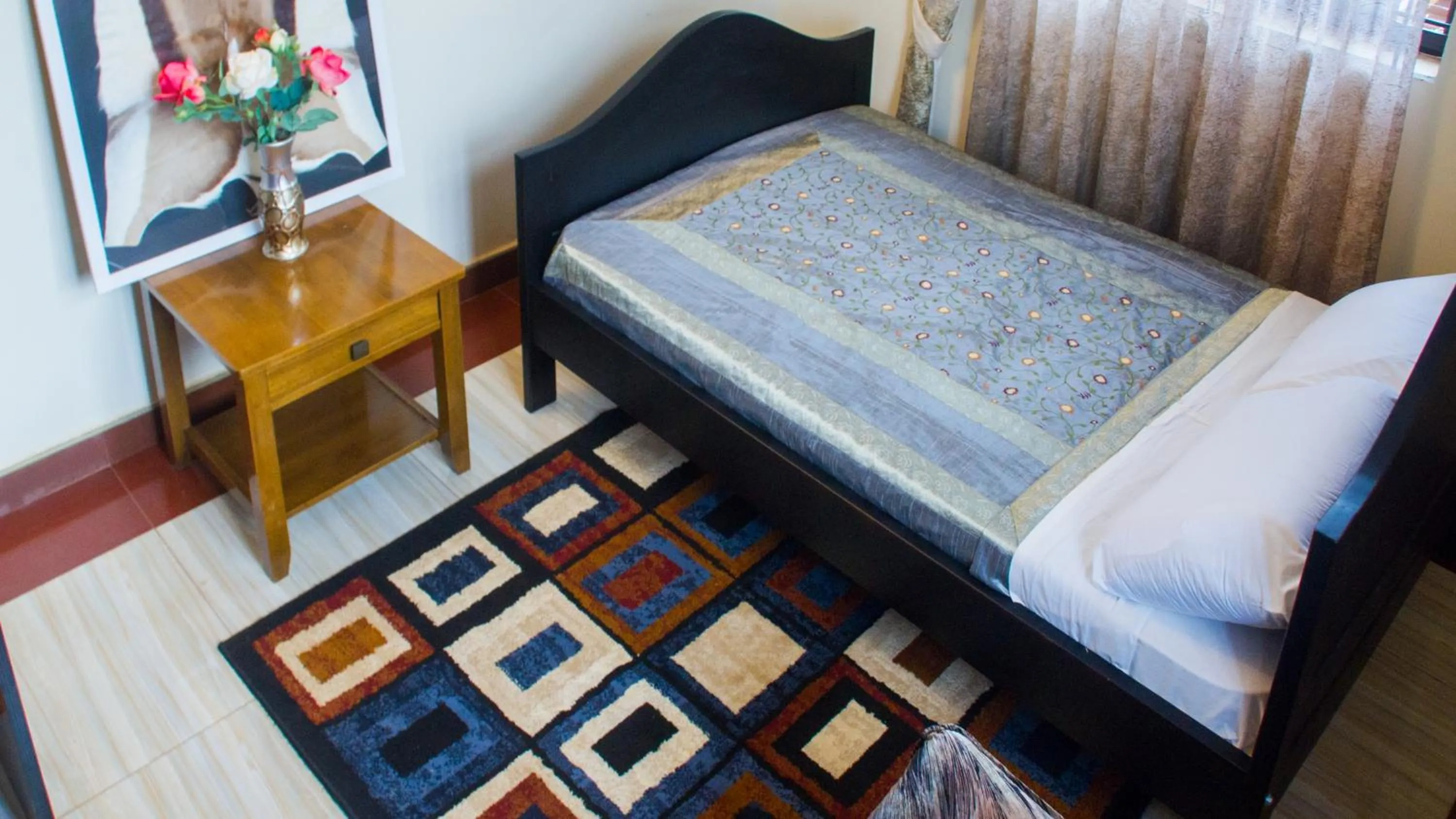 Bed in Bona Safari Villa Bunamwaya