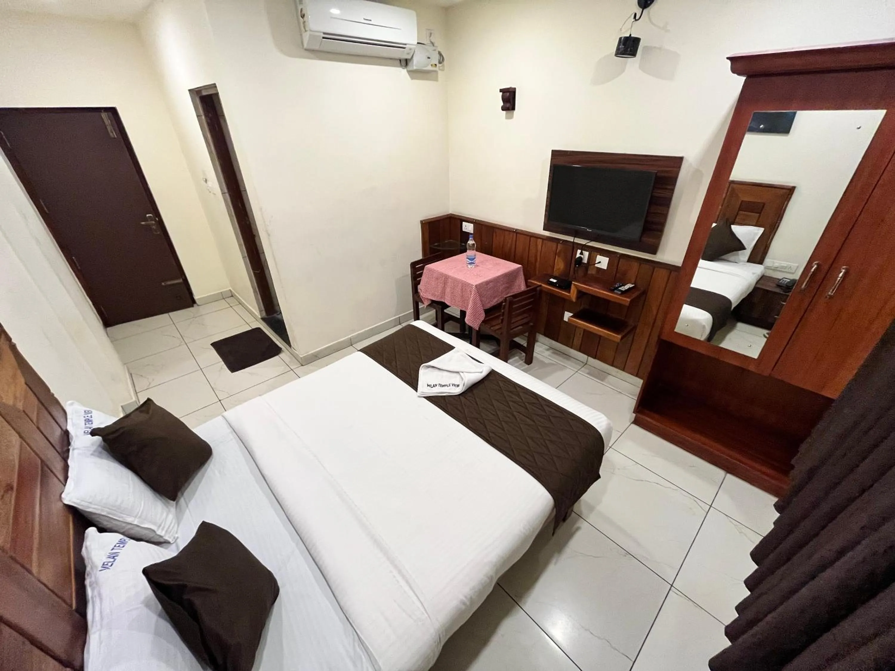 Photo of the whole room, Bed in Velan Temple View