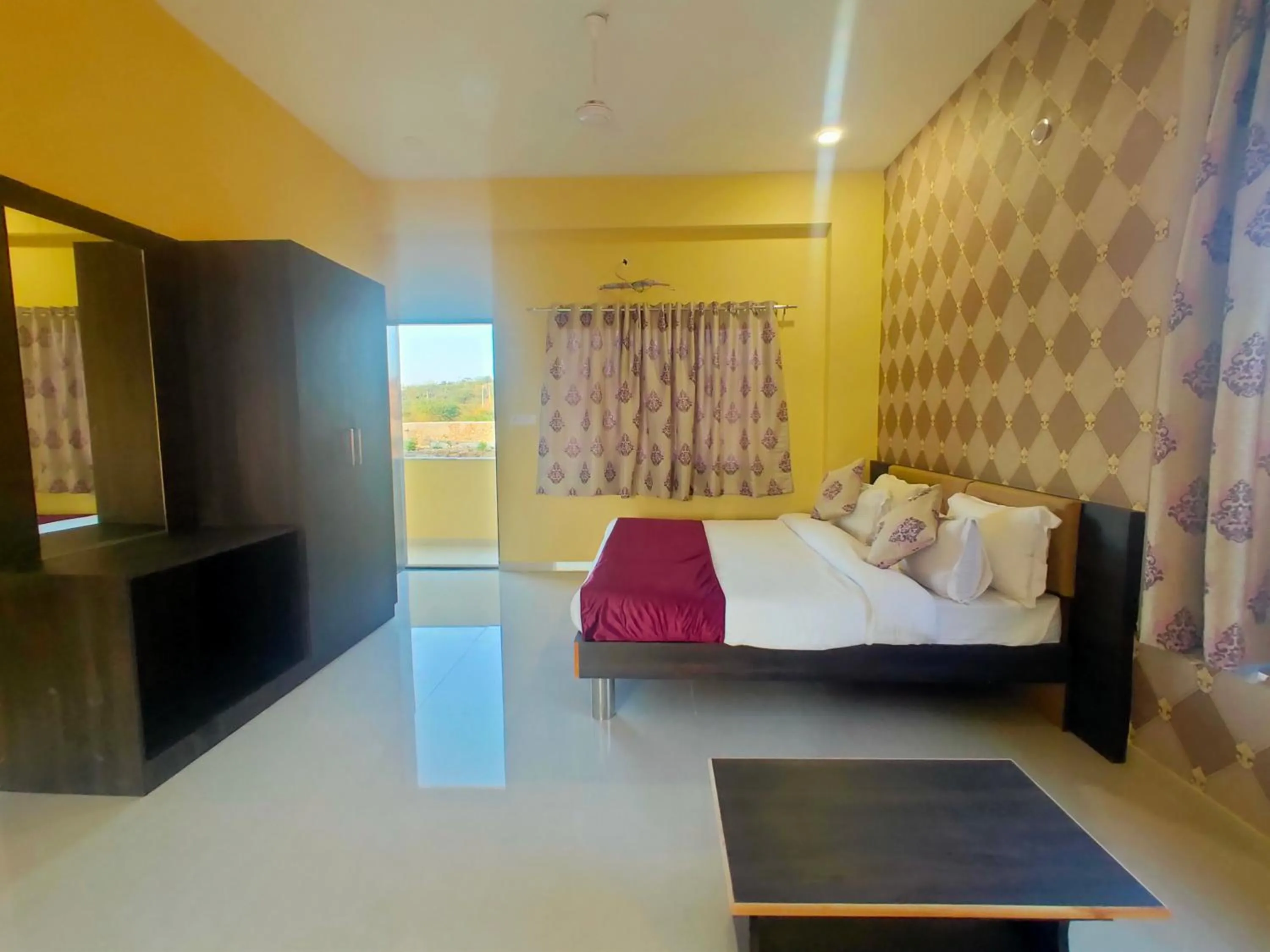 Bed in Vijayam Resort