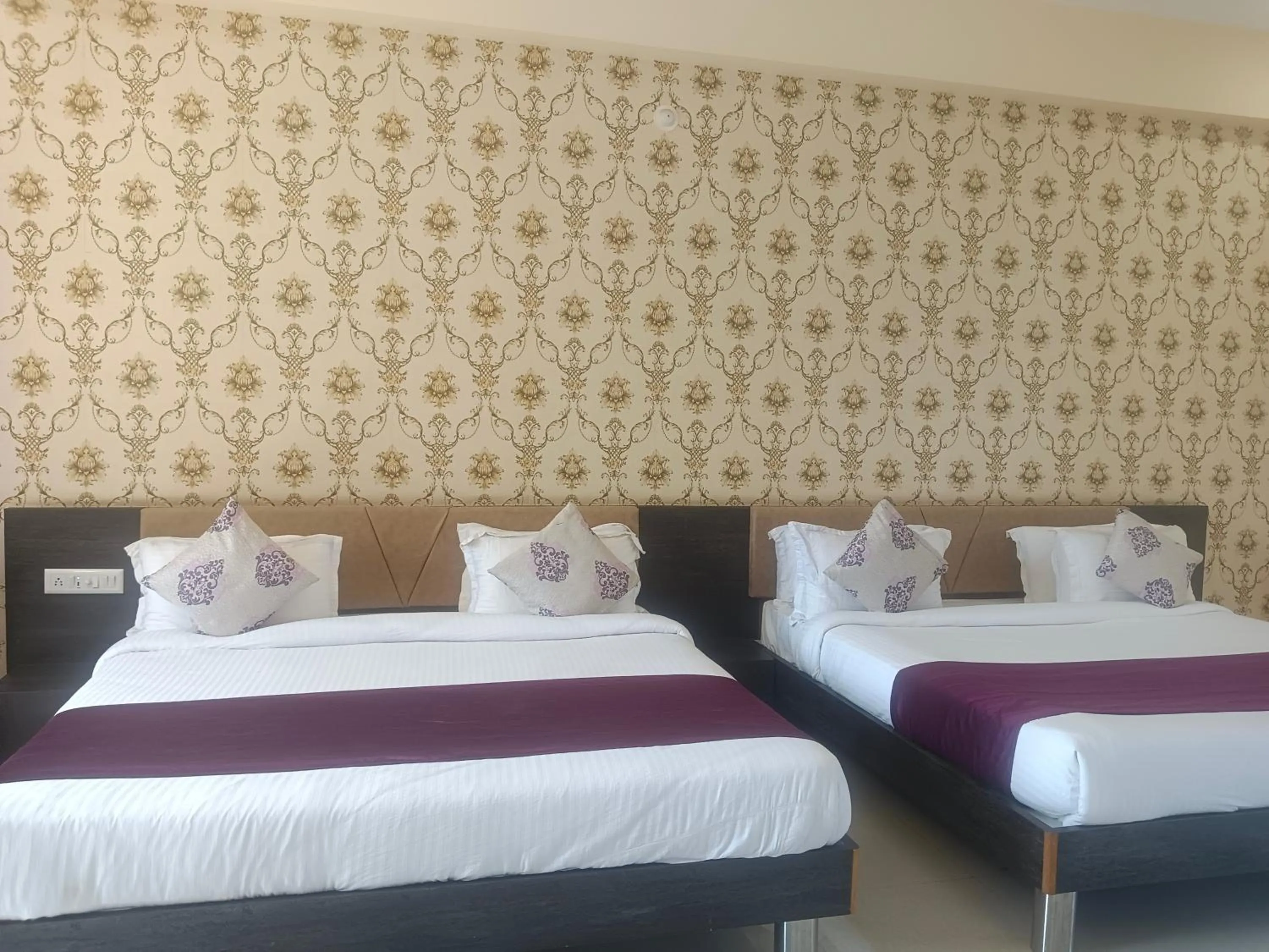 Bed in Vijayam Resort