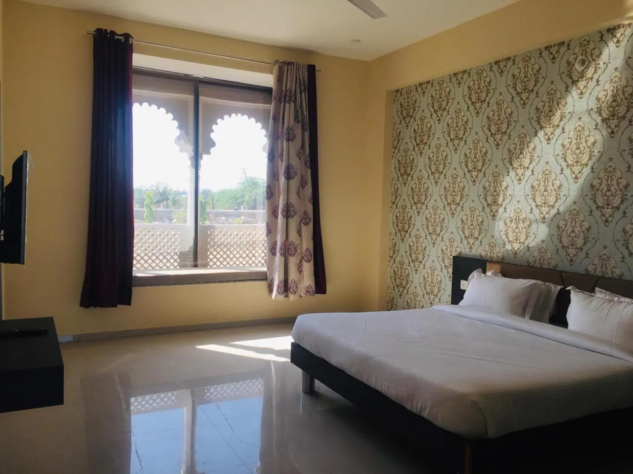Bed in Vijayam Resort