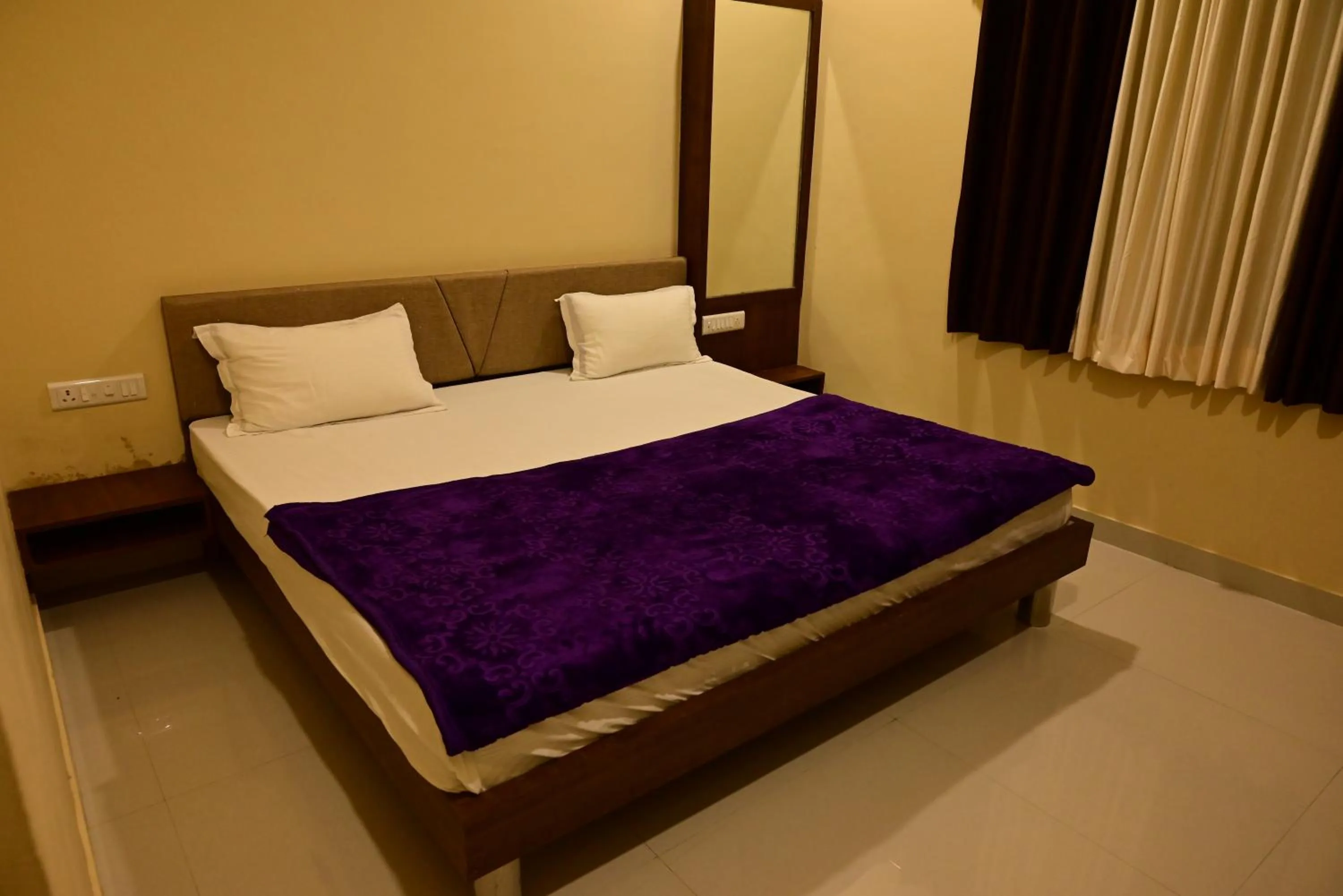 Bed in Vijayam Resort