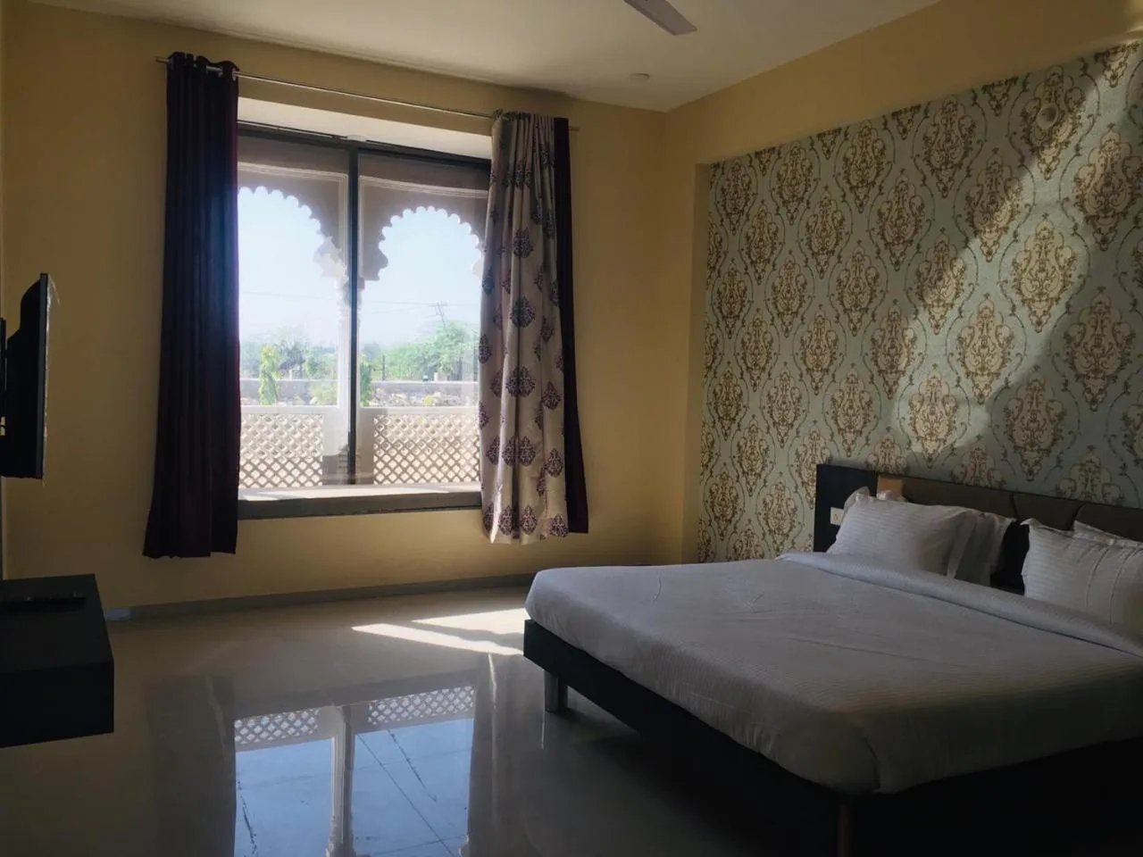 Bed in Vijayam Resort