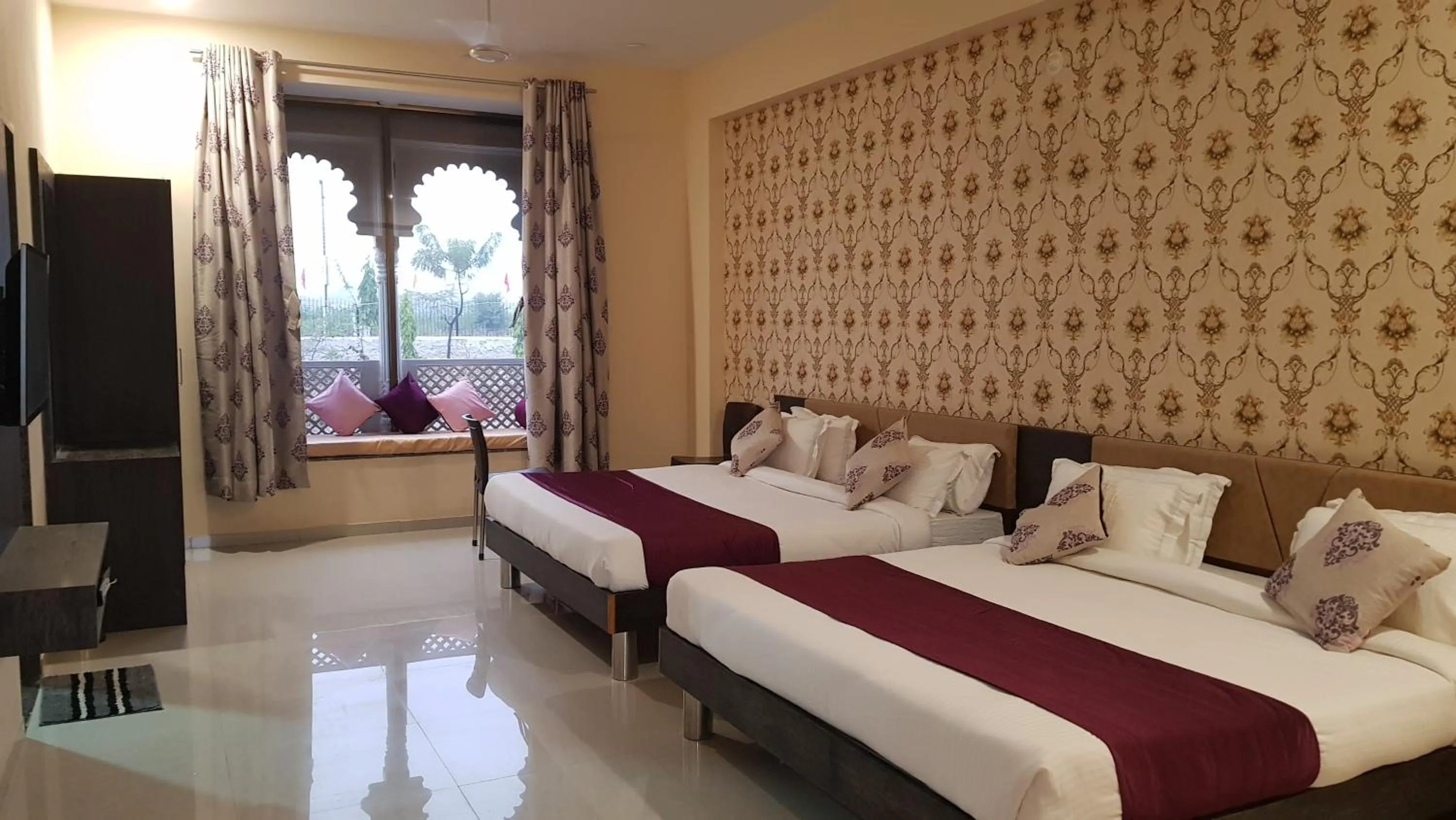 Bed in Vijayam Resort