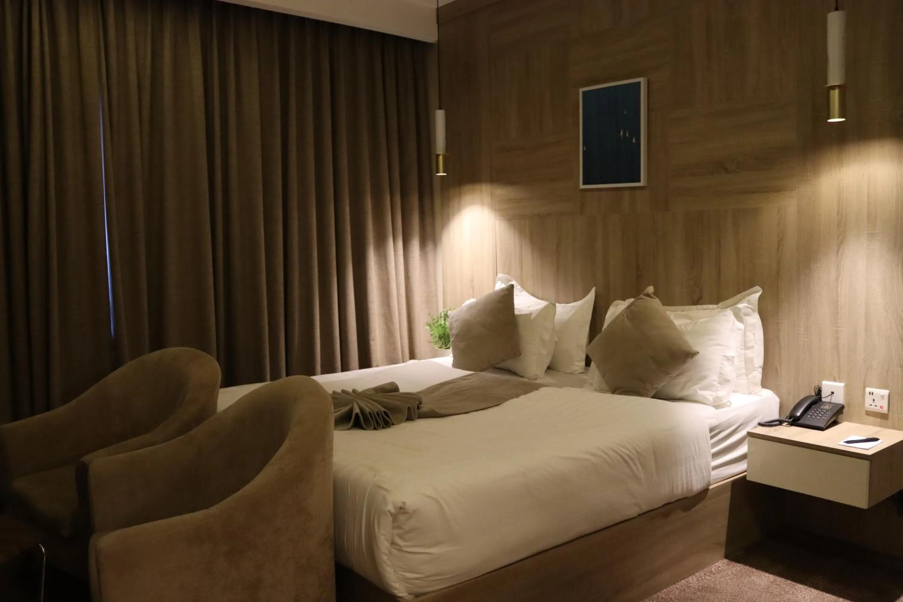 Bed in Twins Boutique Hotel