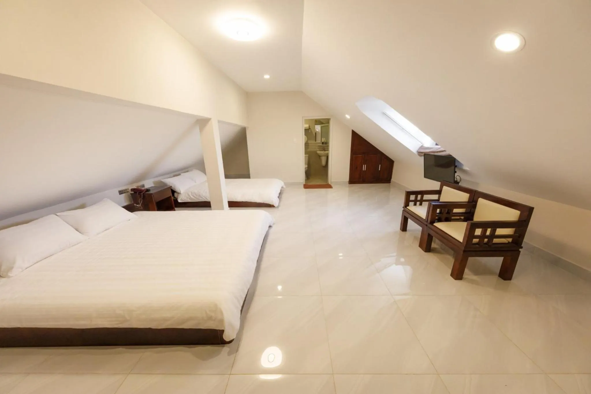 Photo of the whole room, Bed in Bonjour Da Lat Hotel