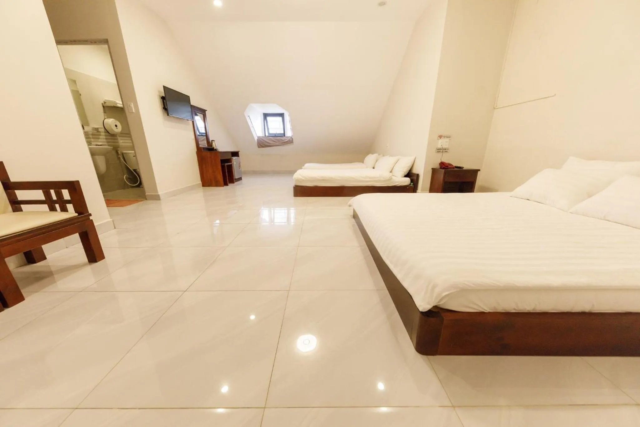 Photo of the whole room, Bed in Bonjour Da Lat Hotel