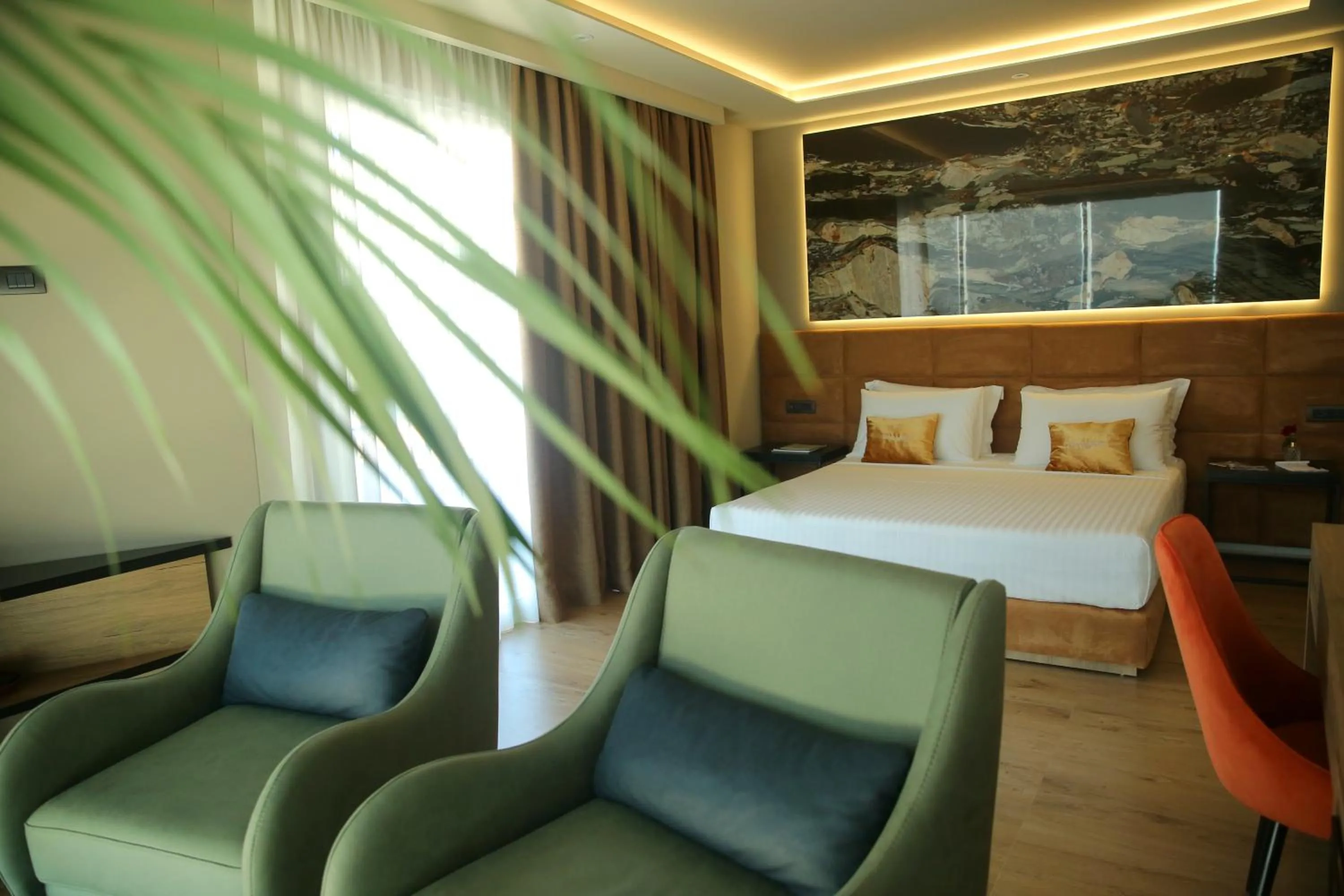 Seating area, Bed in Kraal Hotel Vlore