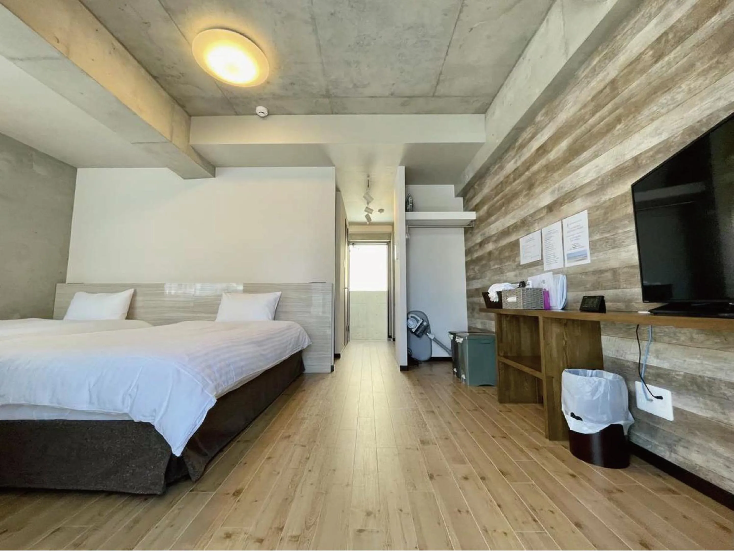 Bed in Infinity Hotel NahaKumoji -SEVEN Hotels and Resorts-