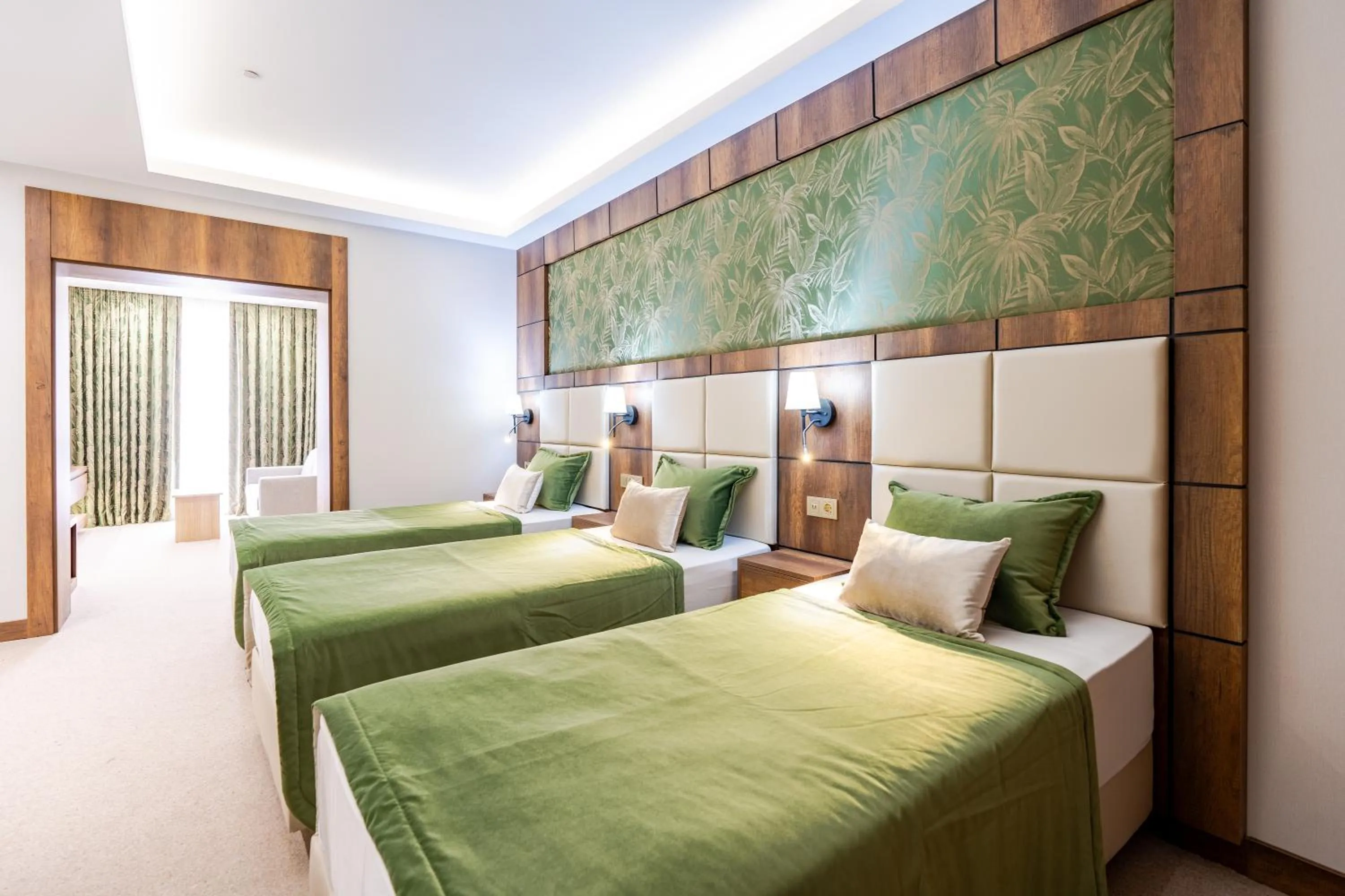 Bed in Mardy Suit Hotel