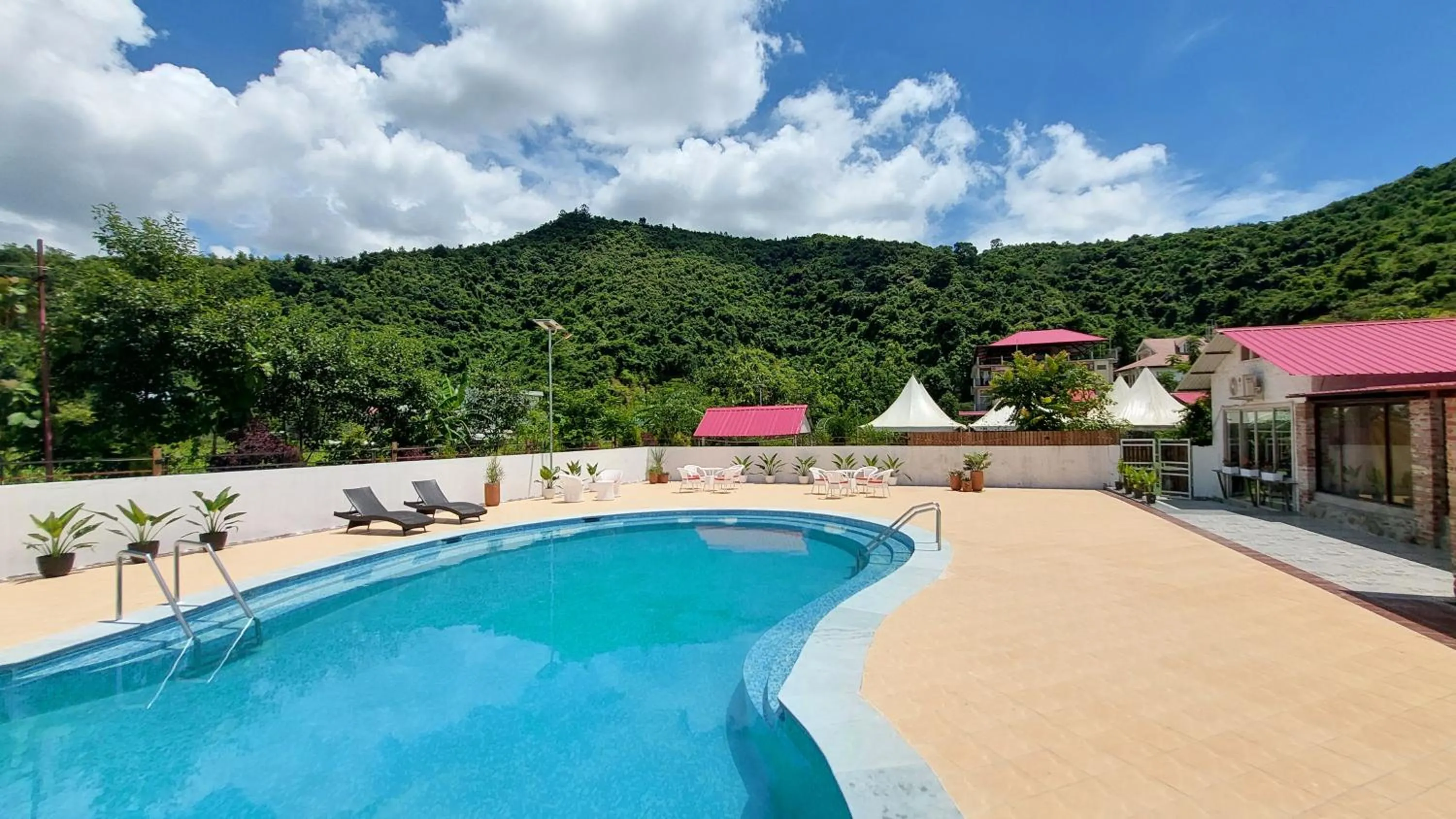 Swimming pool in Shalom Farmhouse by the hillside