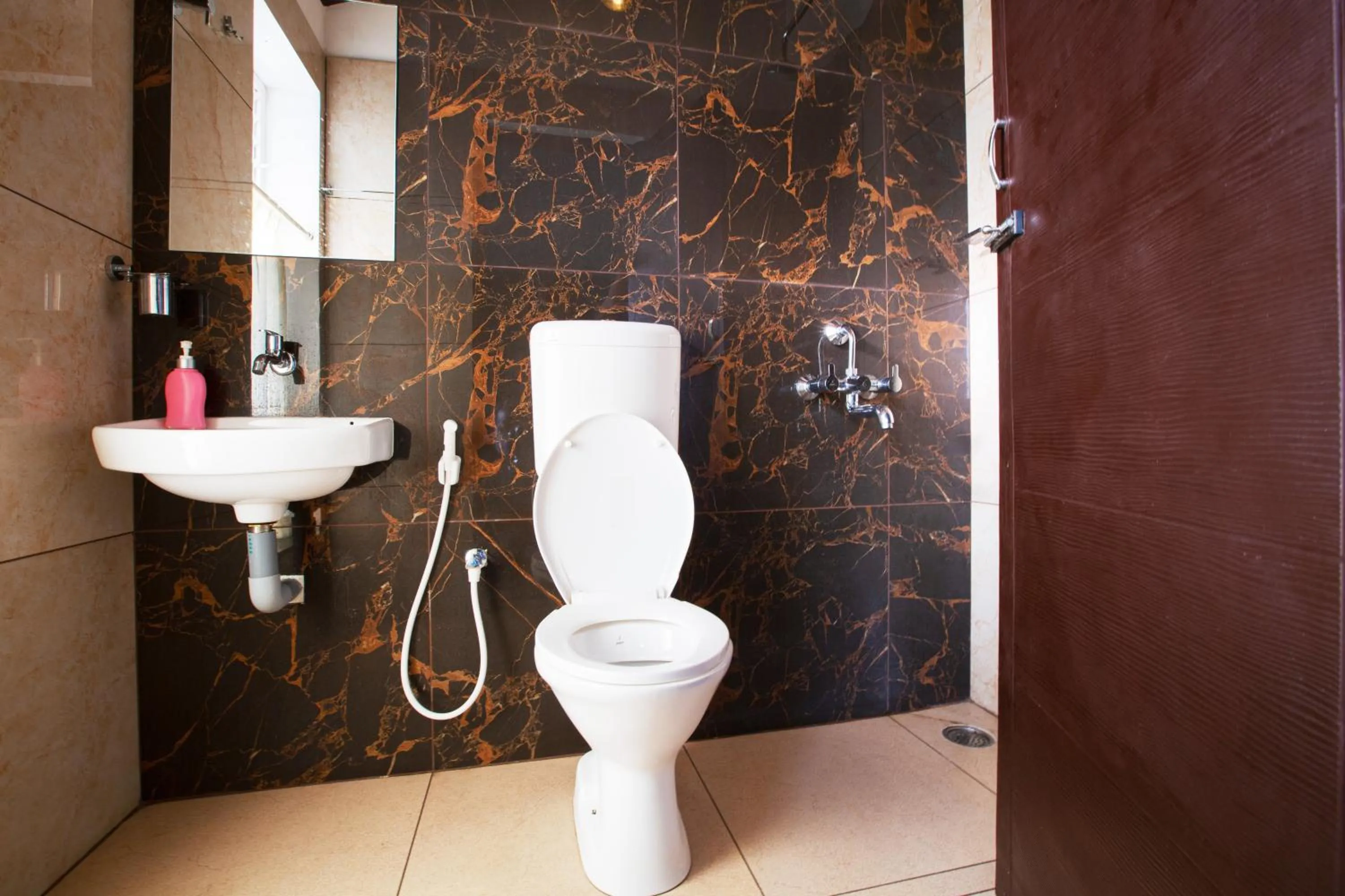 Toilet in Sarvam Serviced Apartment