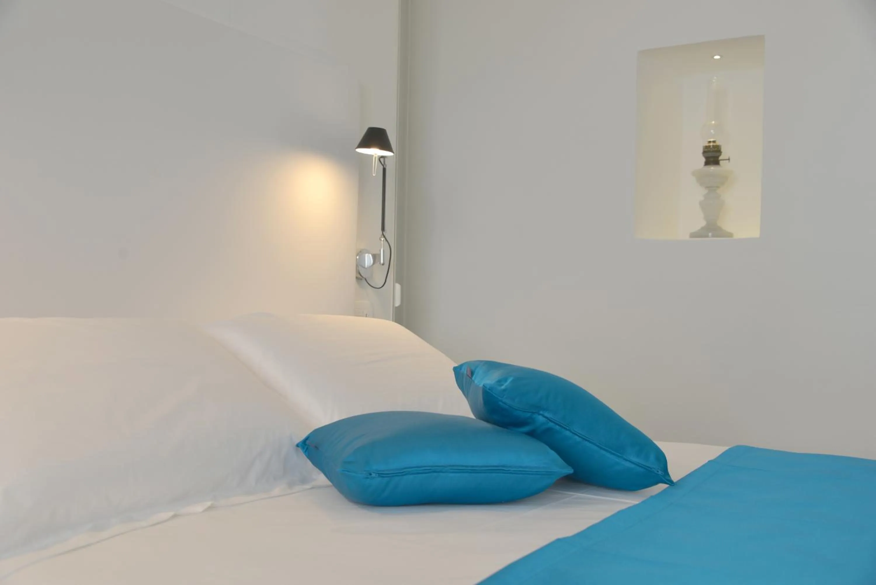 Bed in Sunshine Luxury Rooms