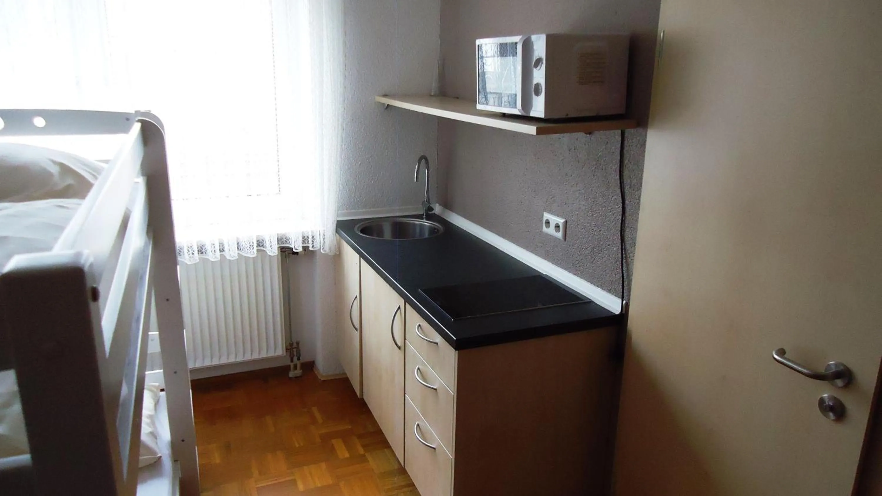 Kitchen or kitchenette, Bed in Hotel Krone