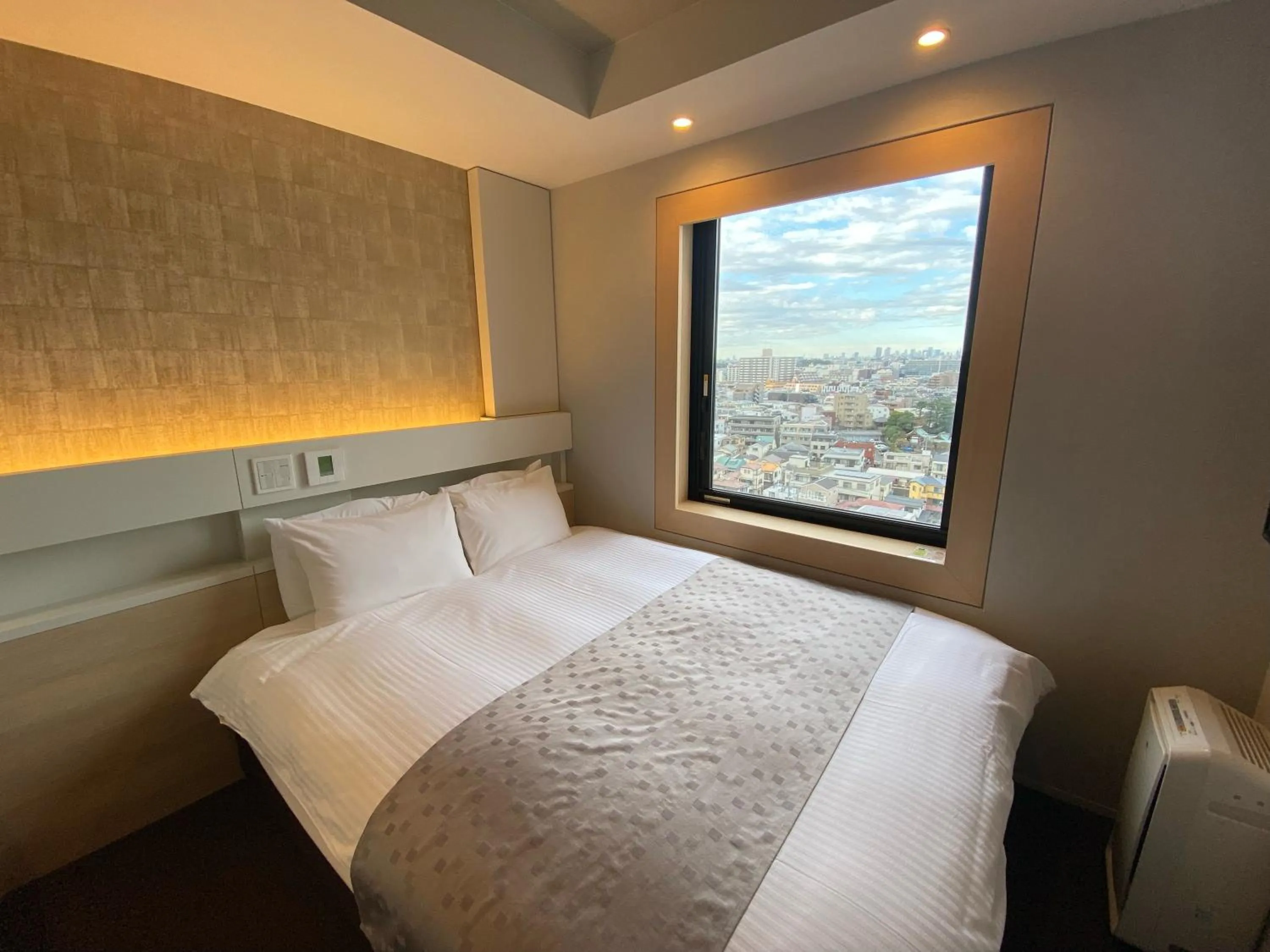 Property building, Bed in APA Hotel Keikyukamata Ekimae