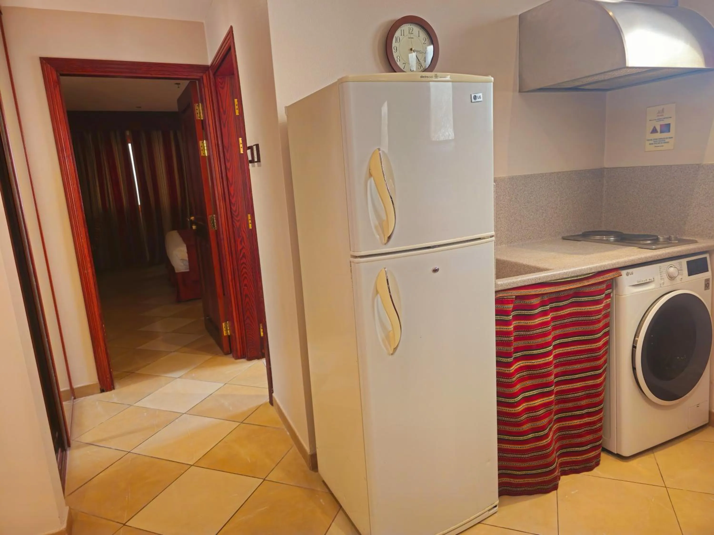 Kitchen or kitchenette in Al Liwan Suites