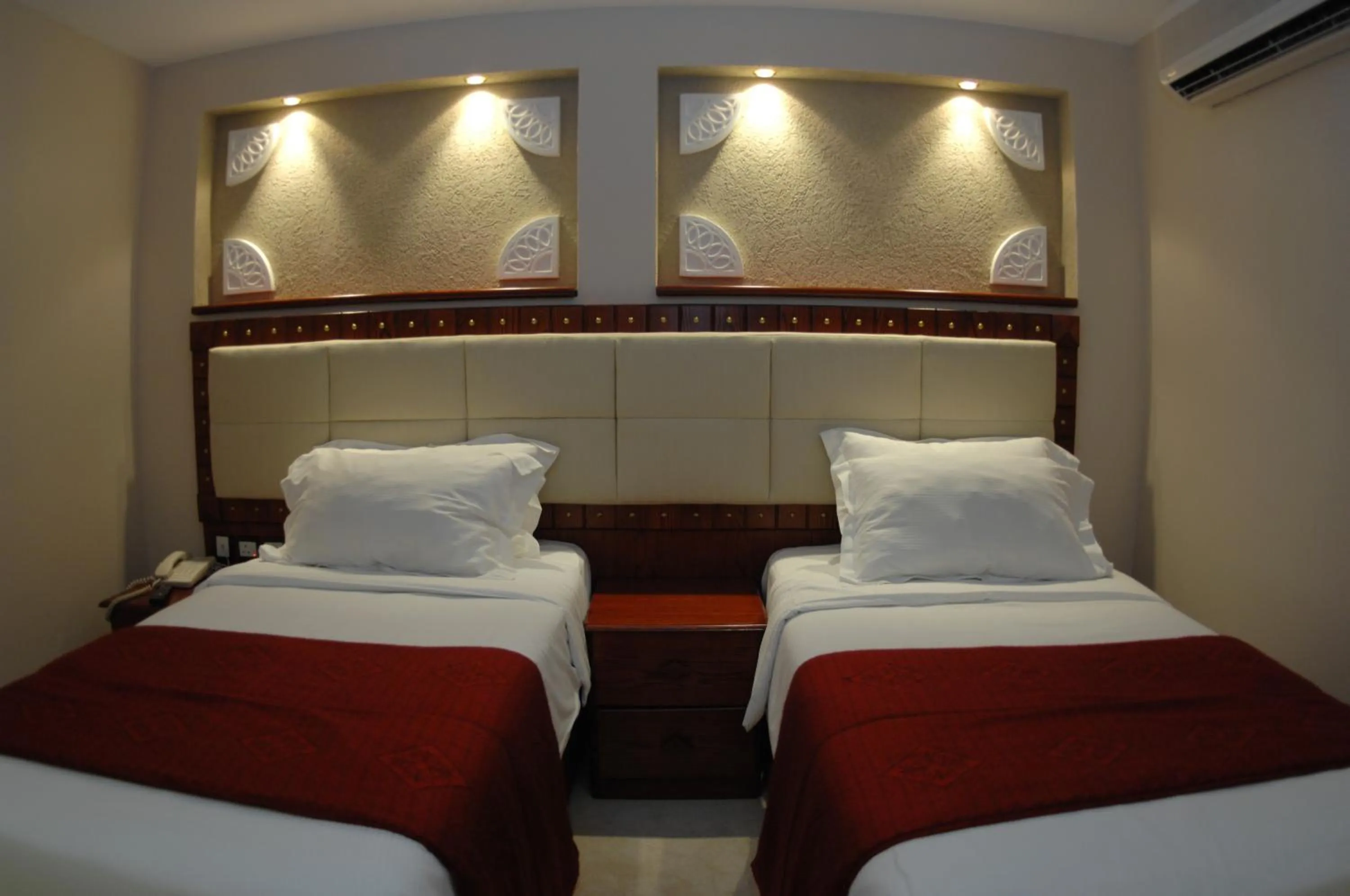 Bed in Al Liwan Suites