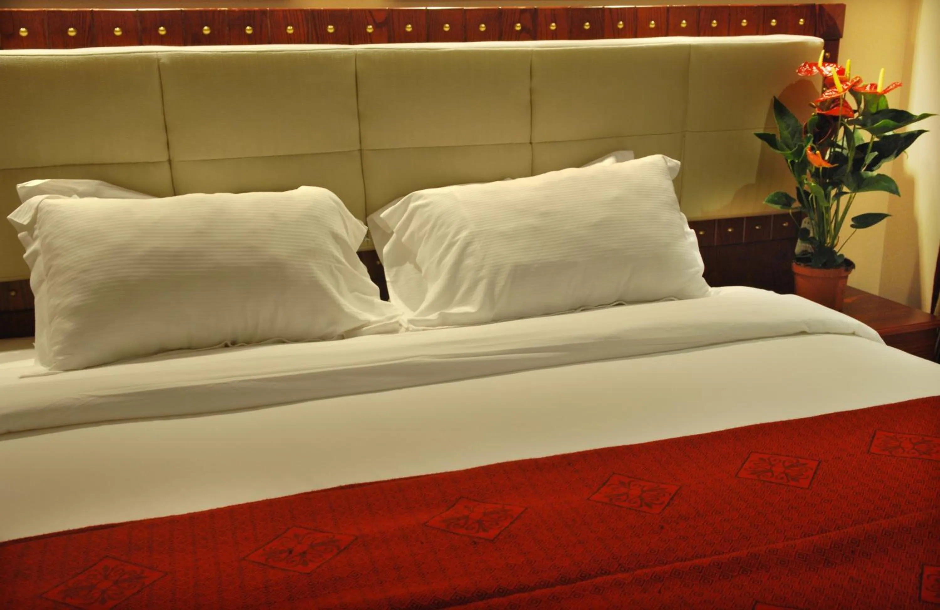 Bed in Al Liwan Suites