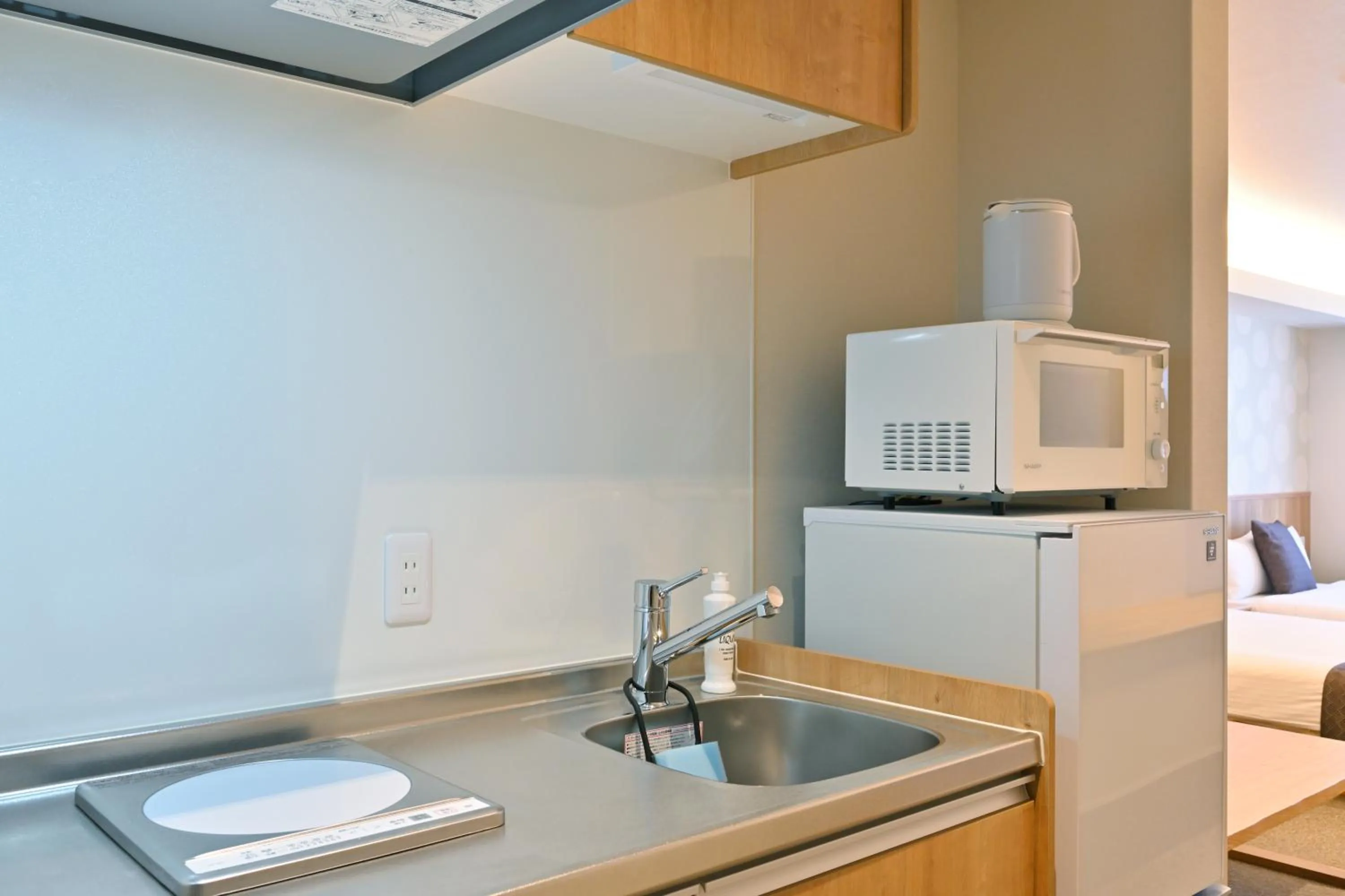 Kitchen or kitchenette in GRAND BASE Hiroshima Peace Memorial Park