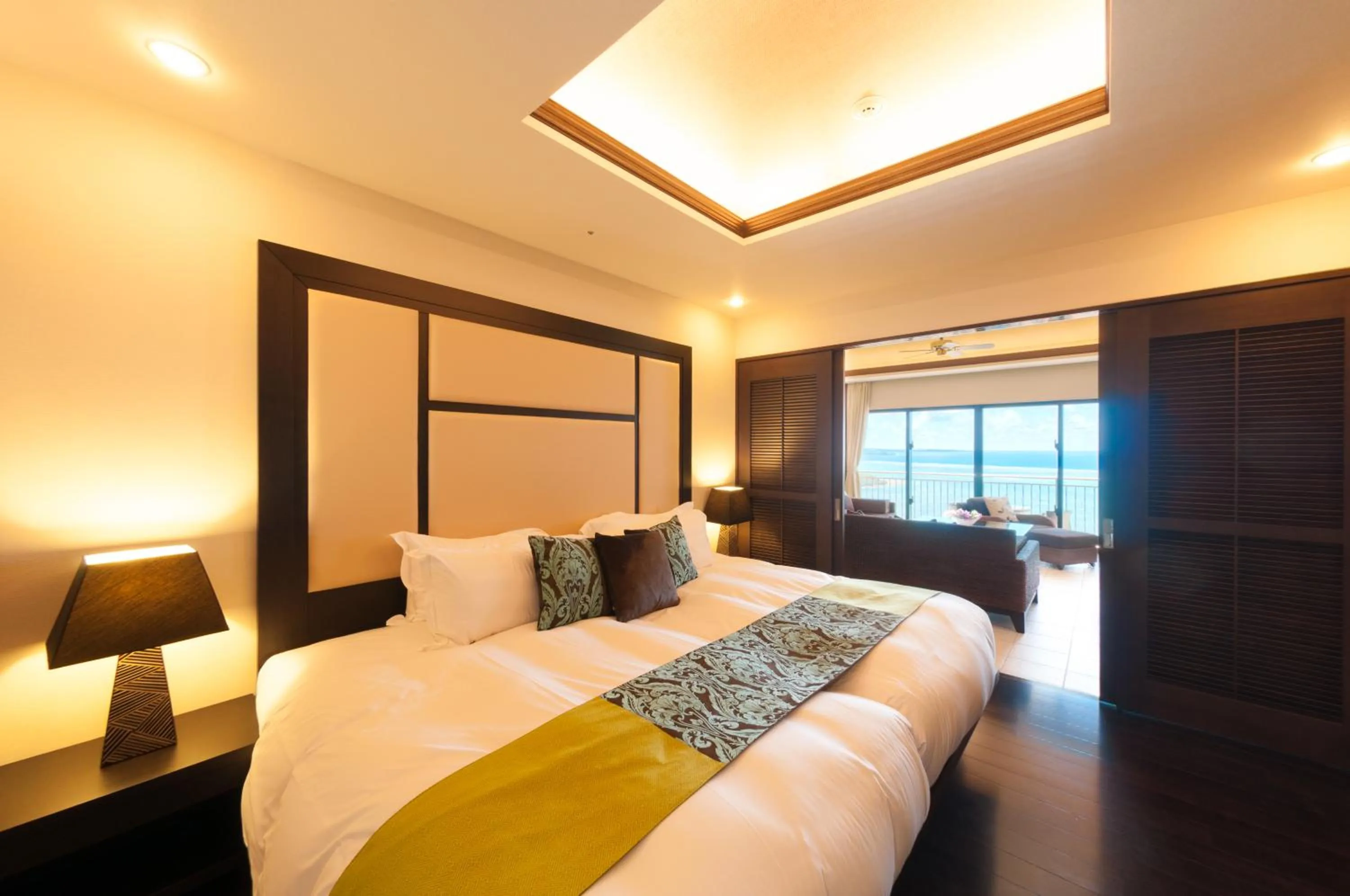 Bed in Kafuu Resort Fuchaku Condo Hotel