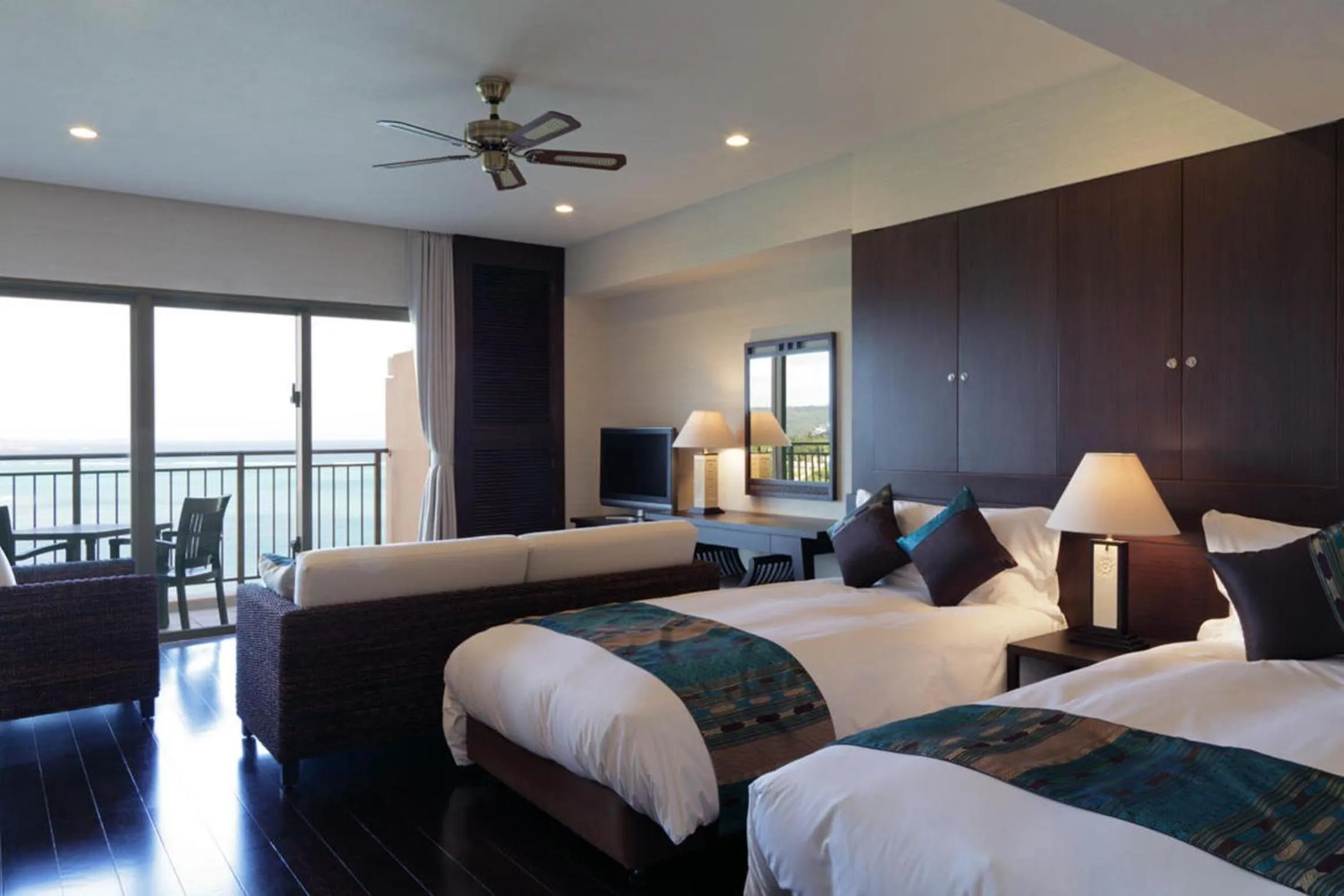 Bed in Kafuu Resort Fuchaku Condo Hotel