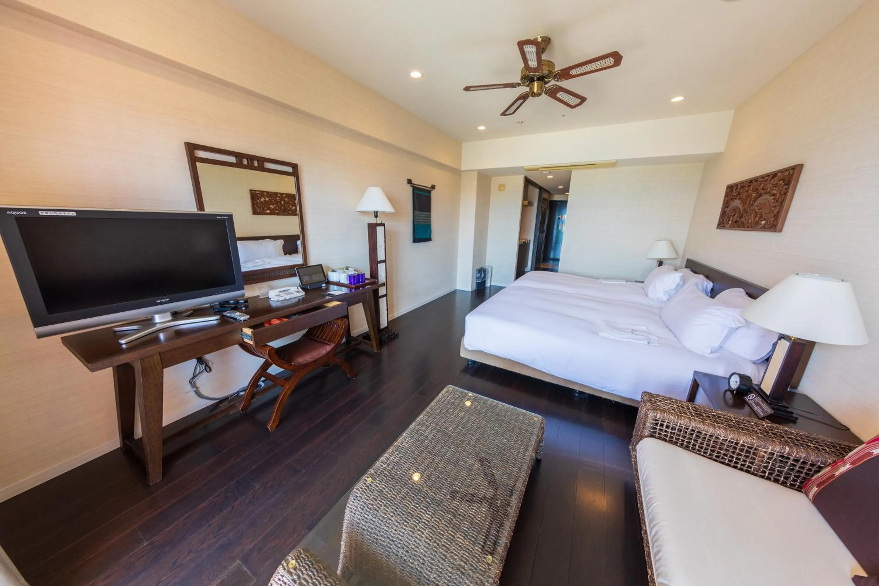 Bed in Kafuu Resort Fuchaku Condo Hotel