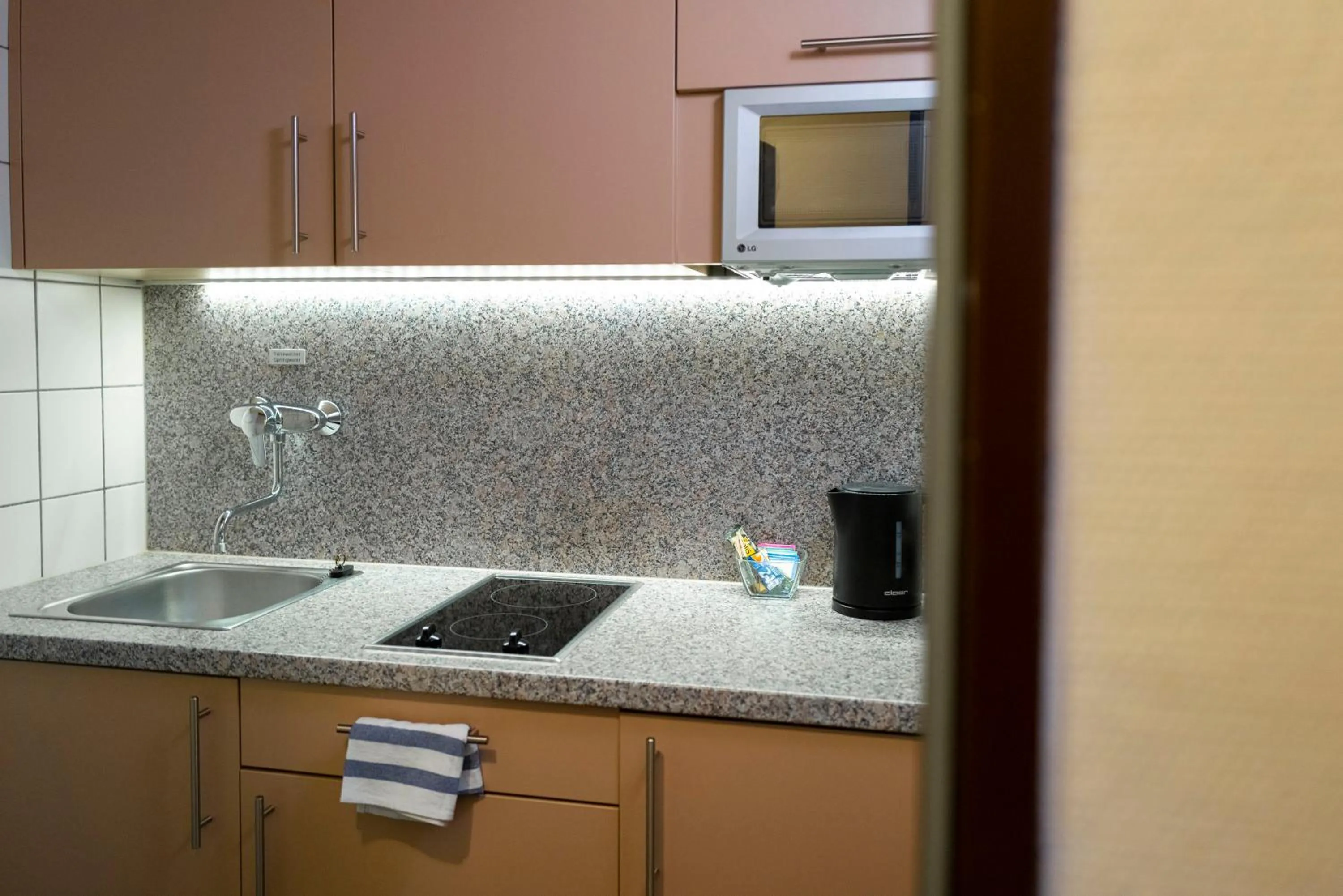 Kitchen or kitchenette in Hotel & Apartments Böhm