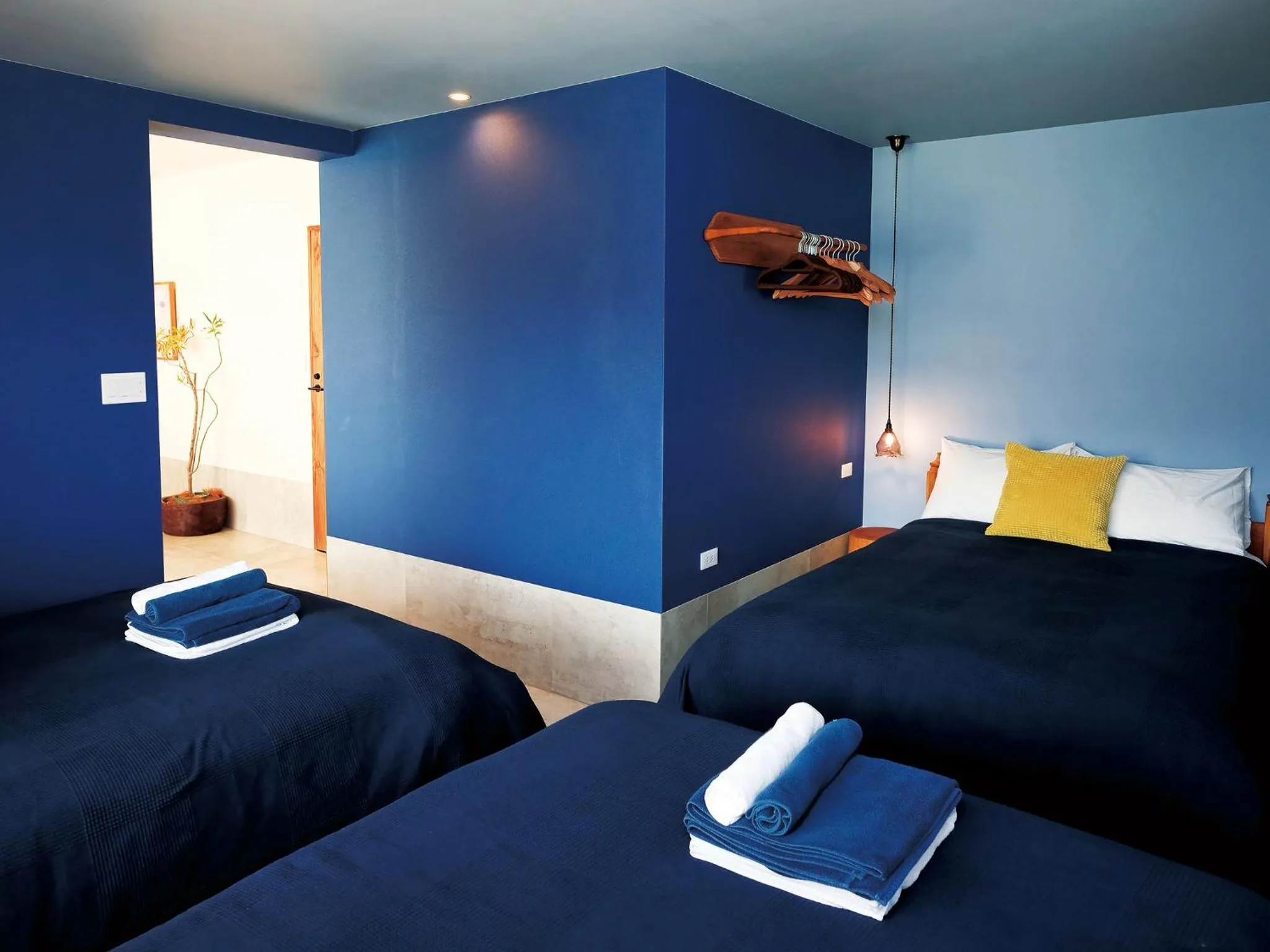 Bedroom, Bed in CHULAX OKINAWA YOMITAN【Designer Condominium Hotel】